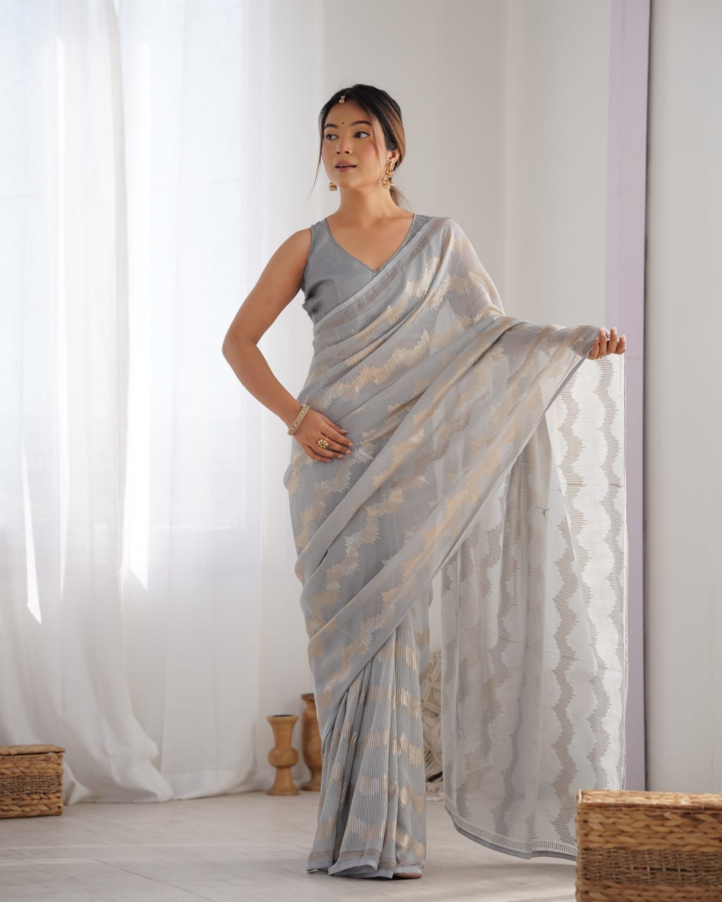 Graceful Aira Grey Georgette saree with heavy sequin embroidery and Seroski diamond embellishments, paired with an unstitched satin Banglori blouse – ideal bridal saree, festive saree, designer grey saree, elegant ethnic party wear, and luxury embroidered saree for women.
