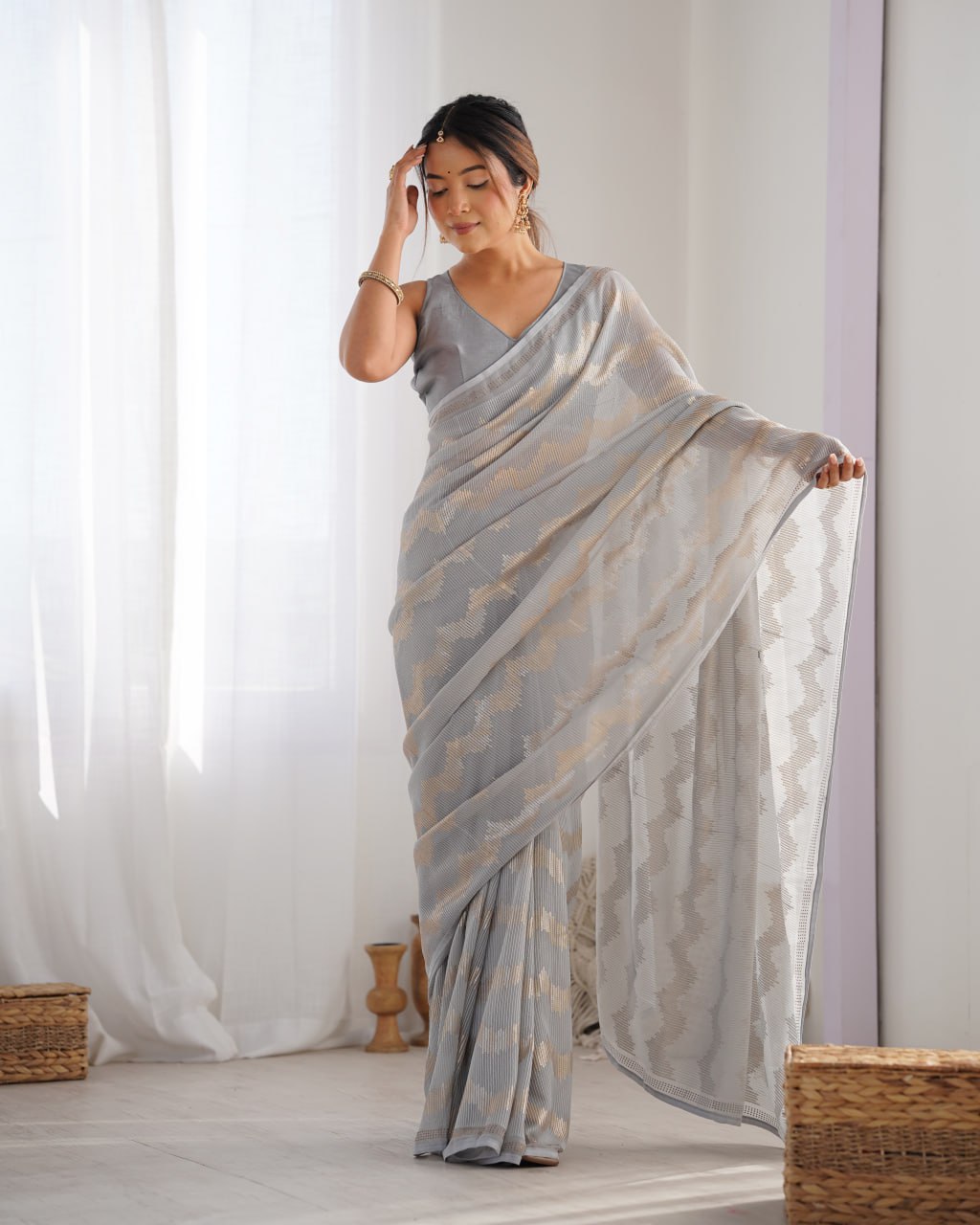 Graceful Aira Grey Georgette saree with heavy sequin embroidery and Seroski diamond embellishments, paired with an unstitched satin Banglori blouse – ideal bridal saree, festive saree, designer grey saree, elegant ethnic party wear, and luxury embroidered saree for women.