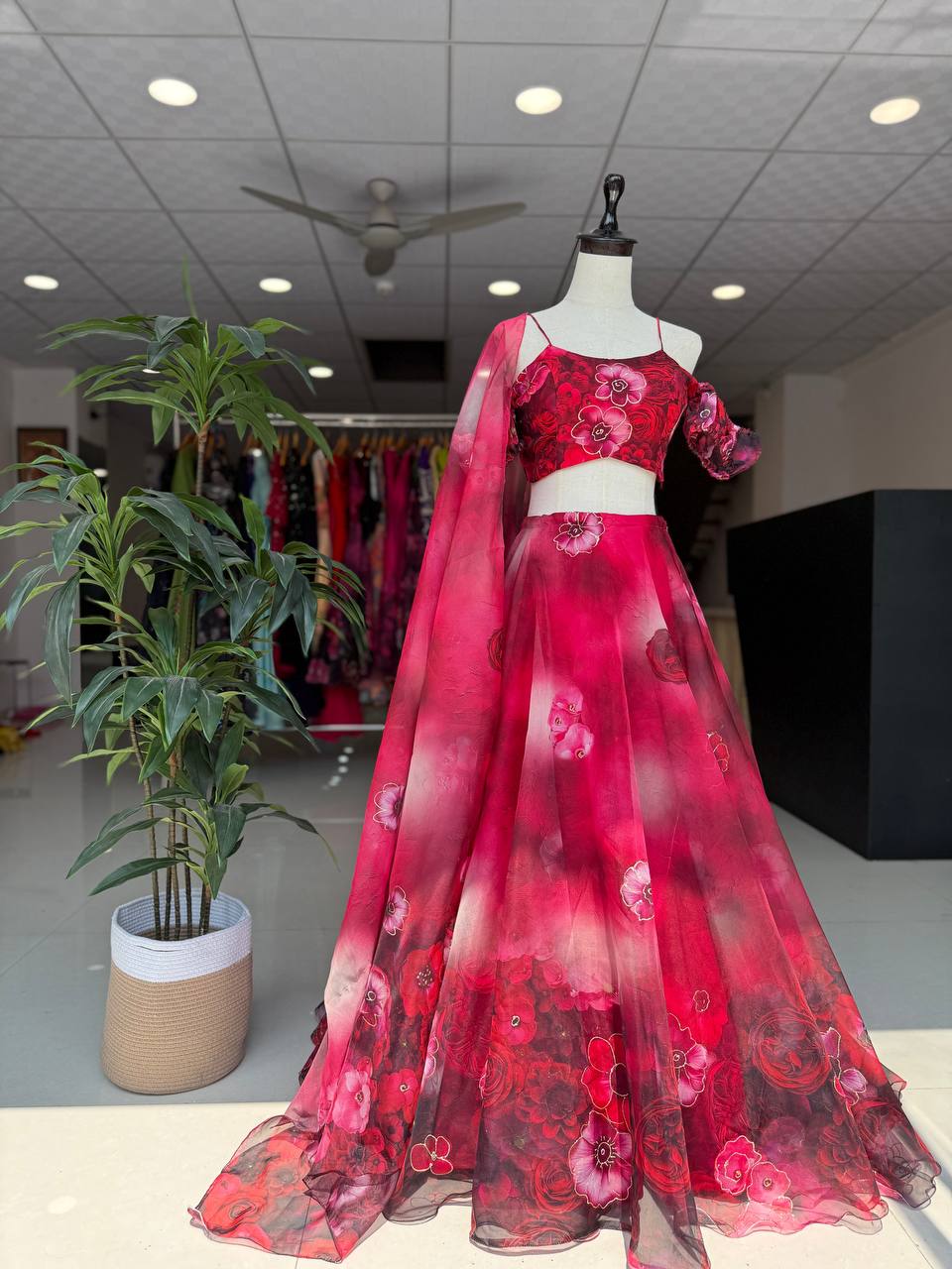 Red pure organza digital print zari work lehenga choli with batwa bag