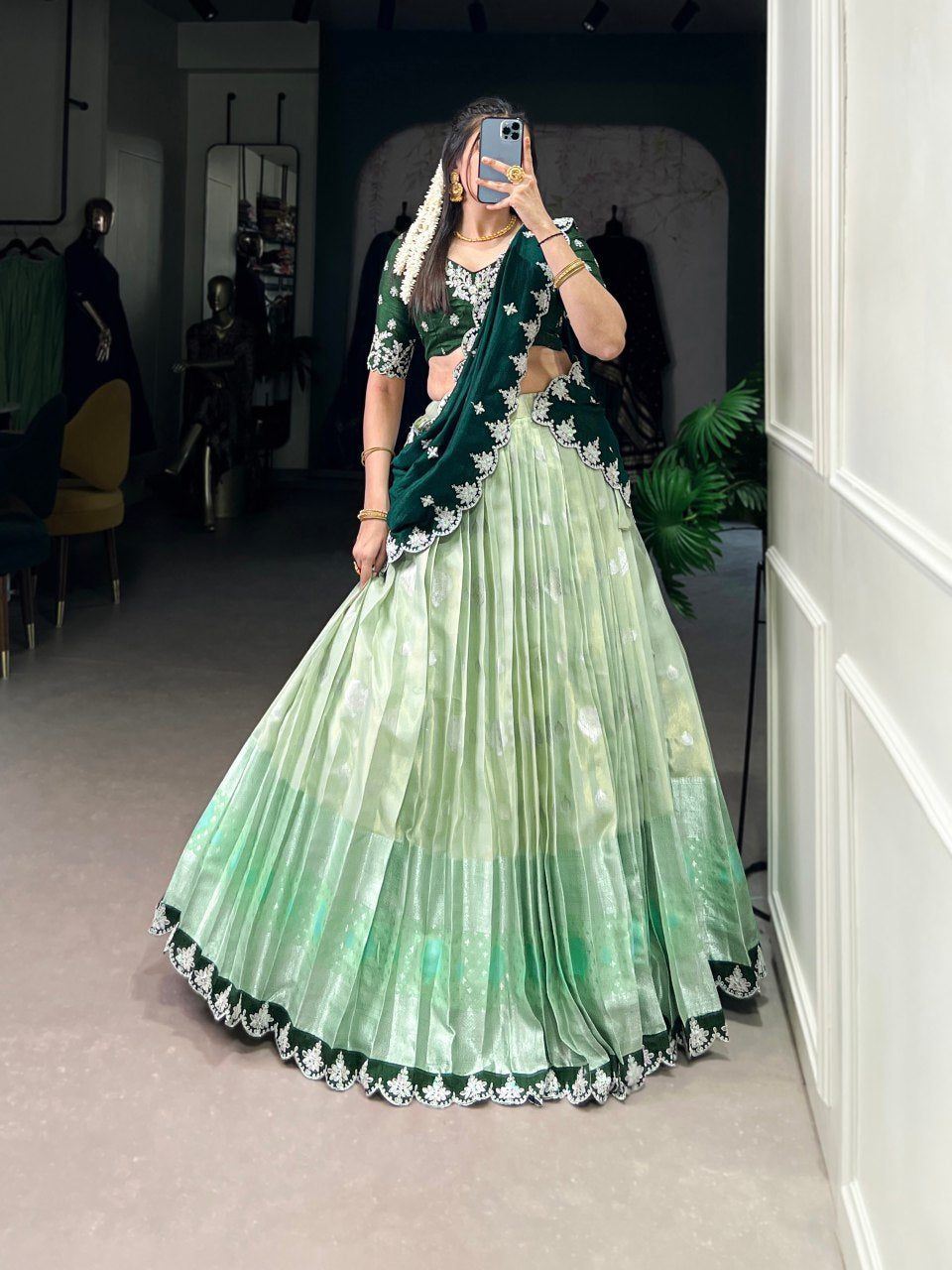 Pista green Zari Kota lehenga with intricate zari weaving work, paired with an embroidered Vichitra silk dupatta – a graceful outfit for festive and wedding occasions