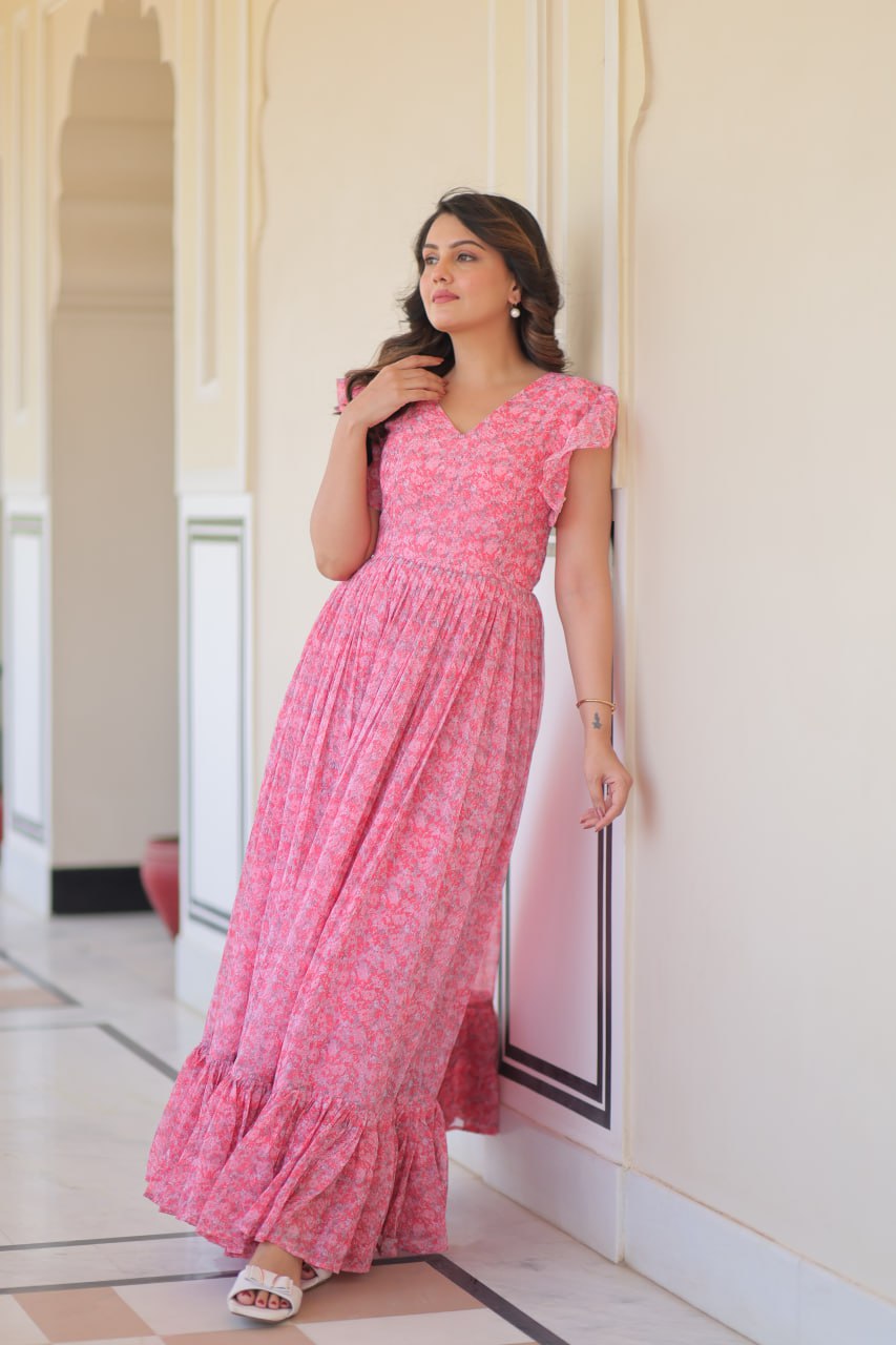 Printed pink georgette gown for women with 7-meter flair, bell sleeves & V-neck—lightweight ethnic dress for Haldi, Mehendi, Navratri & festive functions.