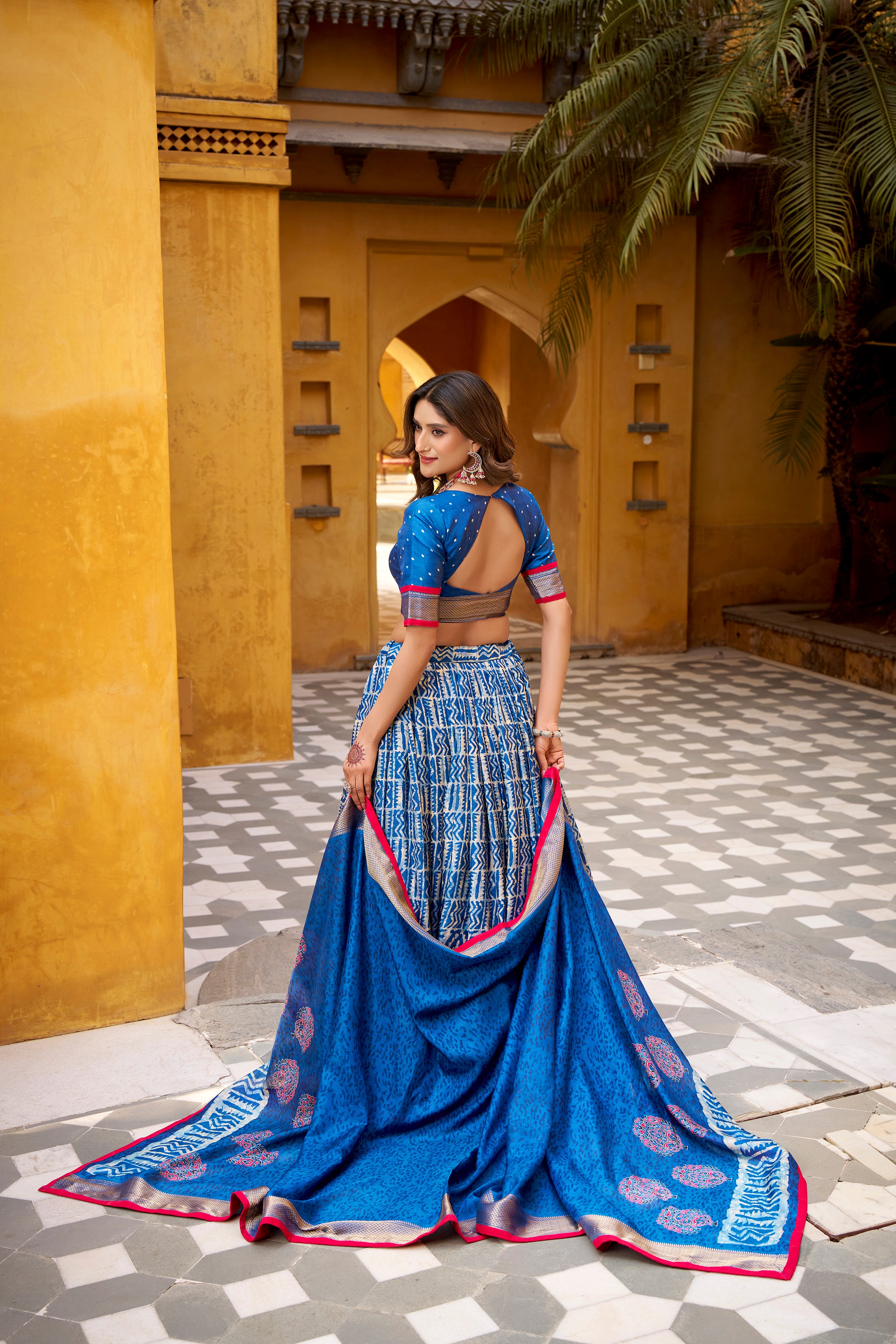 Girija Blue Color Dola Silk Batik Print With Zari
Weaving Work Lehenga Choli