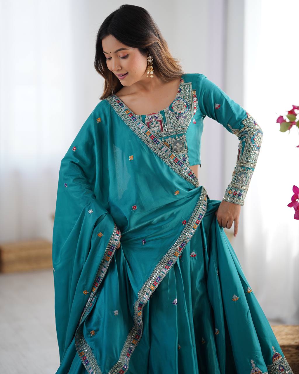 Kavyani Natural Crepe Silk Teal Color Lehenga Choli Set – semi-stitched lehenga with 3-meter flair, cancan and canvas patta, intricately embroidered with coding dori, thread, and sequins; paired with unstitched matching choli and embroidered dupatta with lace border, premium festive and wedding ethnic wear for women by Trinaari.