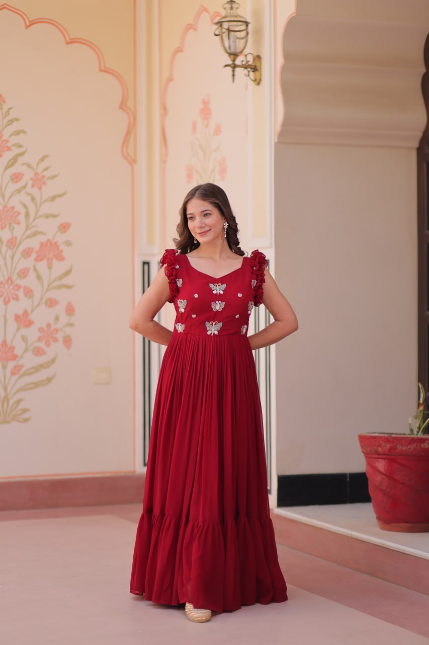 Lavi 7-meter flared designer gown in faux blooming fabric with sequin & bead embroidery, V-neck & frill shoulders – perfect for weddings & parties.