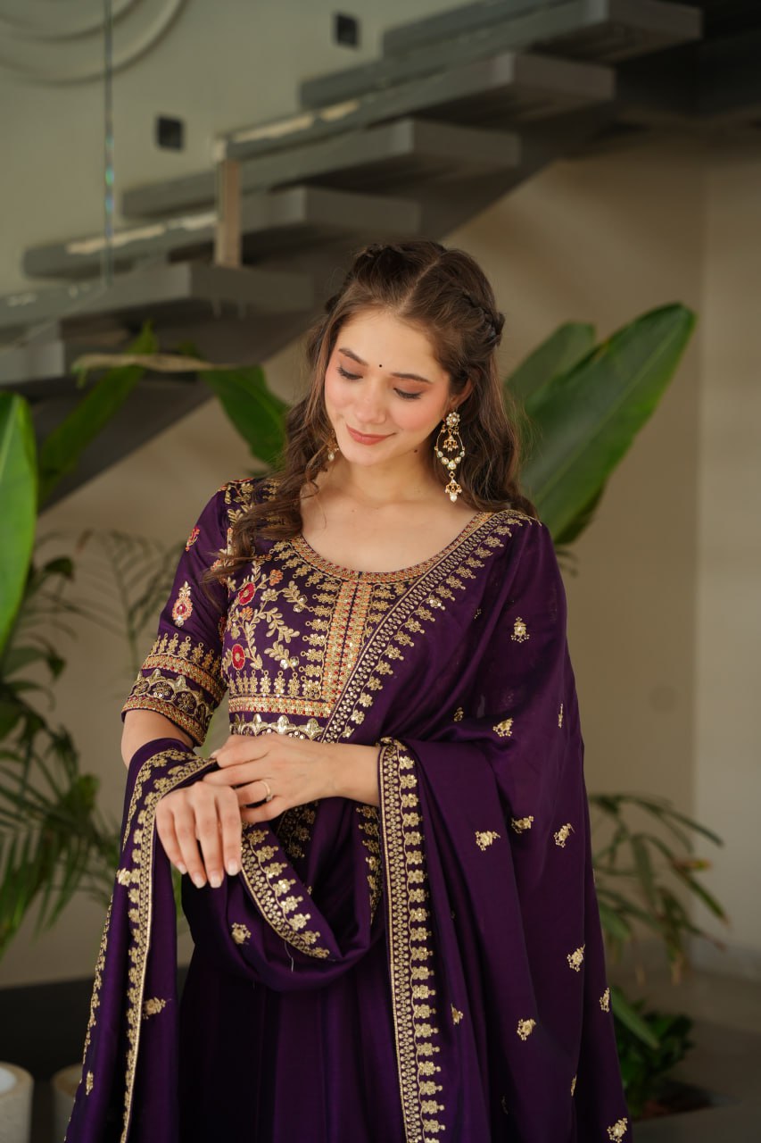 Aadishri Purple Vichitra Silk Gown with multi-sequins and zari embroidery – perfect Indian ethnic wear for weddings, party wear dresses for women, designer gown for women, traditional Indian dress, Indian clothing for women, ethnic wear for girls, gown for wedding function, Indian dress online shopping, full sleeve gown for women, festive wear for ladies.