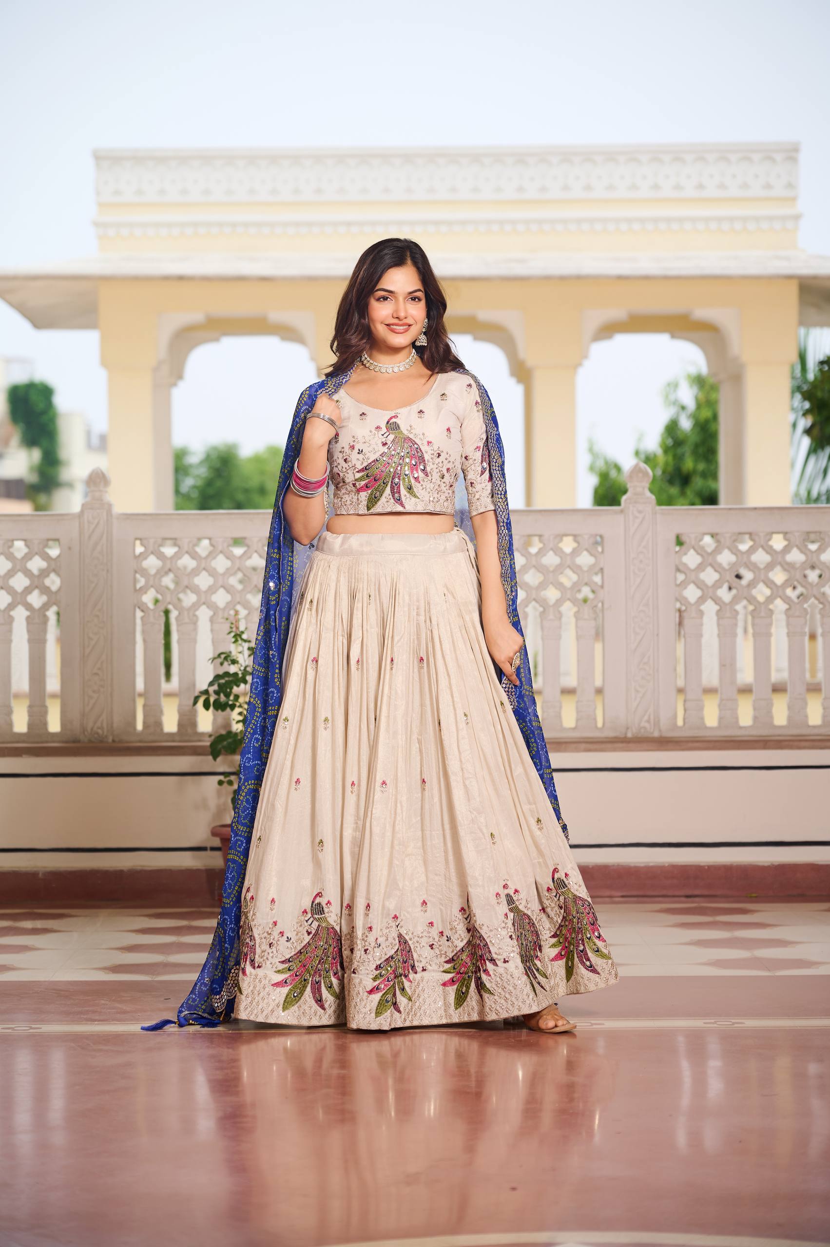 Amla Off-White Tissue Silk Sequins Thread Work Lehenga Choli with Blue Bandhej Dupatta