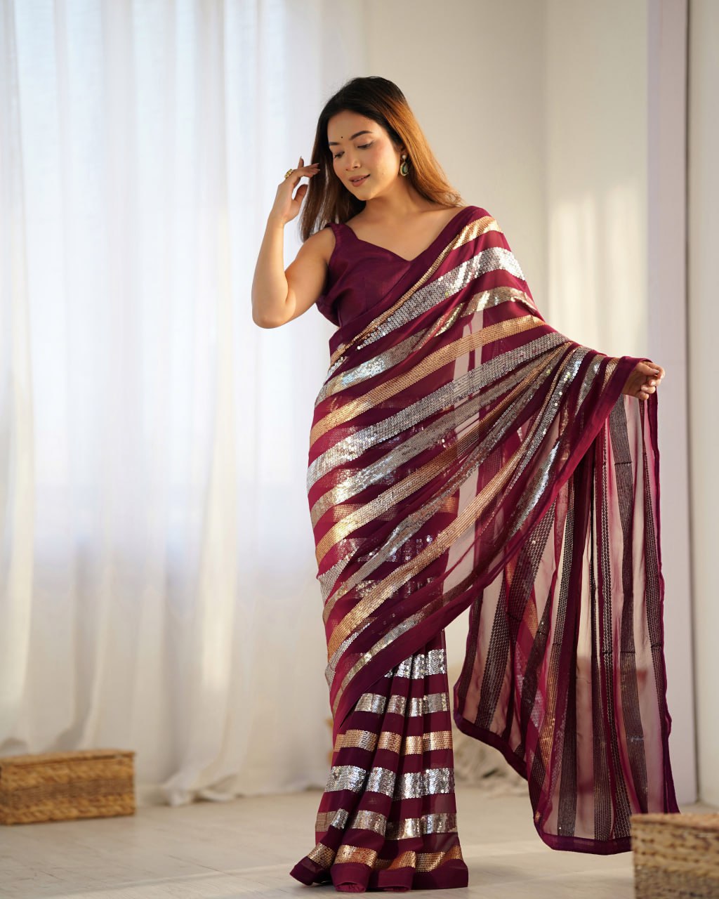 Kira Wine Georgette Saree with 3MM to 7MM sequin embroidery, elegant lining pattern and mono Banglory blouse – ideal sequin saree for wedding receptions, cocktail parties, festive wear, and premium Bollywood-style designer look.