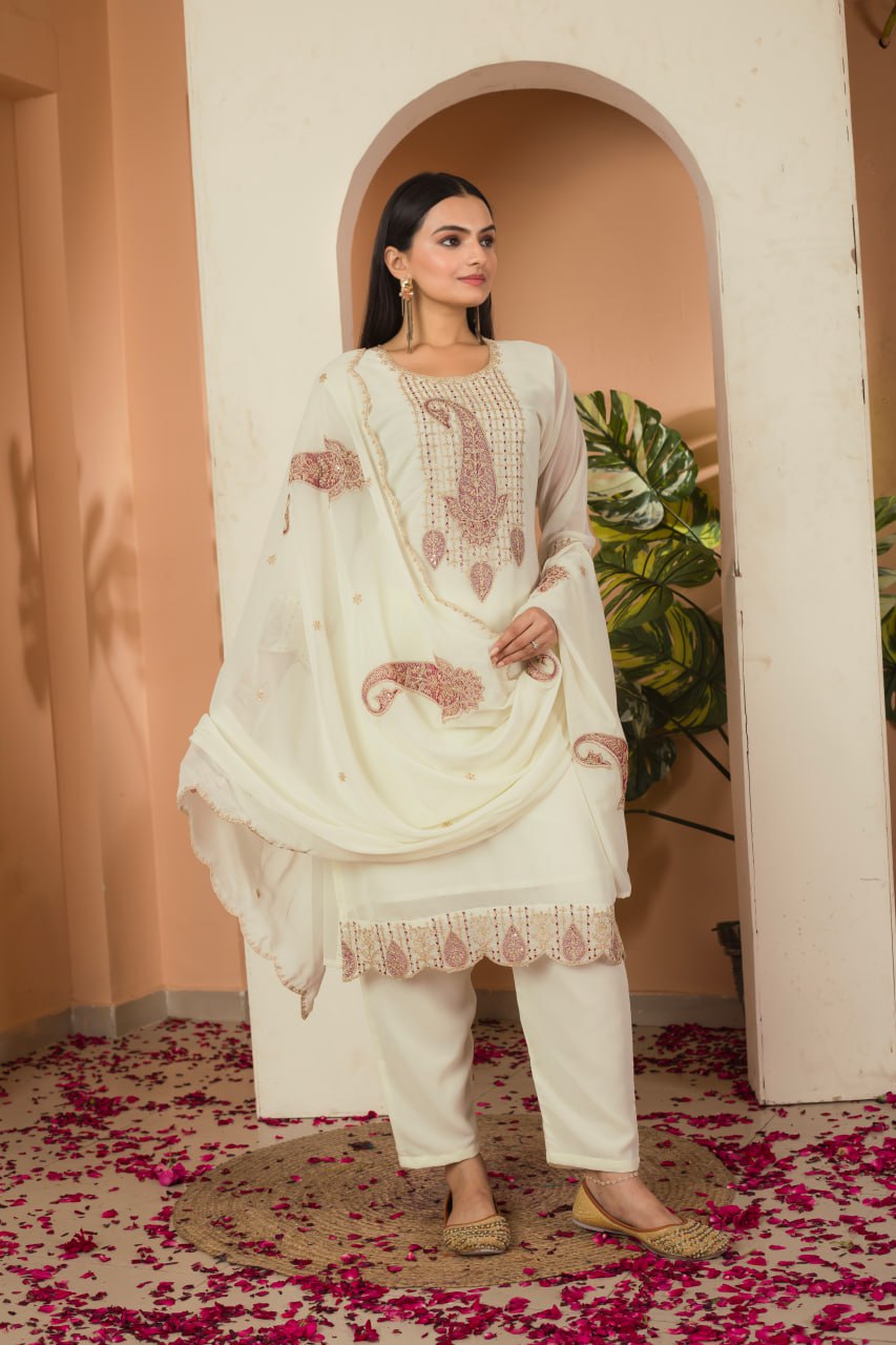 Khyati Off-White Embroidered Kurti Set crafted from premium Fox Georgette, featuring intricate heavy thread and sequins embroidery. This elegant ensemble includes a fully stitched kurti with a butter crepe lining, a matching stitched bottom, and an embroidered Fox Georgette dupatta. Designed for festive gatherings and special occasions, it beautifully blends tradition with modern sophistication