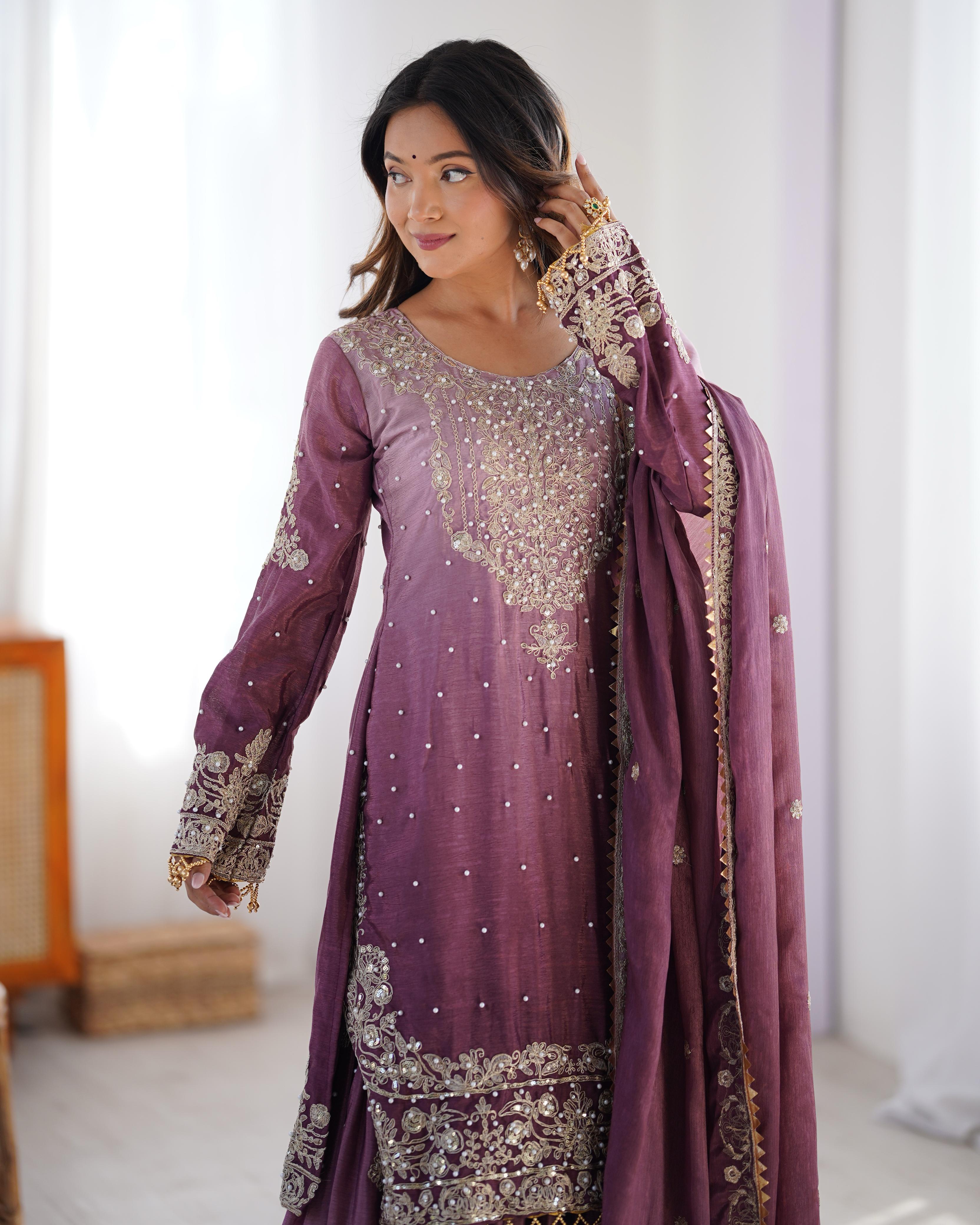 This Manvisha Pink Embroidered Sharara Suit Set is a premium choice for wedding wear, partywear sharara suits, and festive ethnic outfits. Made from luxurious Chinon silk, this designer sharara set features intricate cording dori embroidery, sequins work, and rivet moti detailing, making it perfect for Indian wedding outfits. The fully stitched kurta showcases embroidery on both the front and back, complementing the stylish embroidered sharara pants with an elastic waistband for a comfortable fit. Paired wi