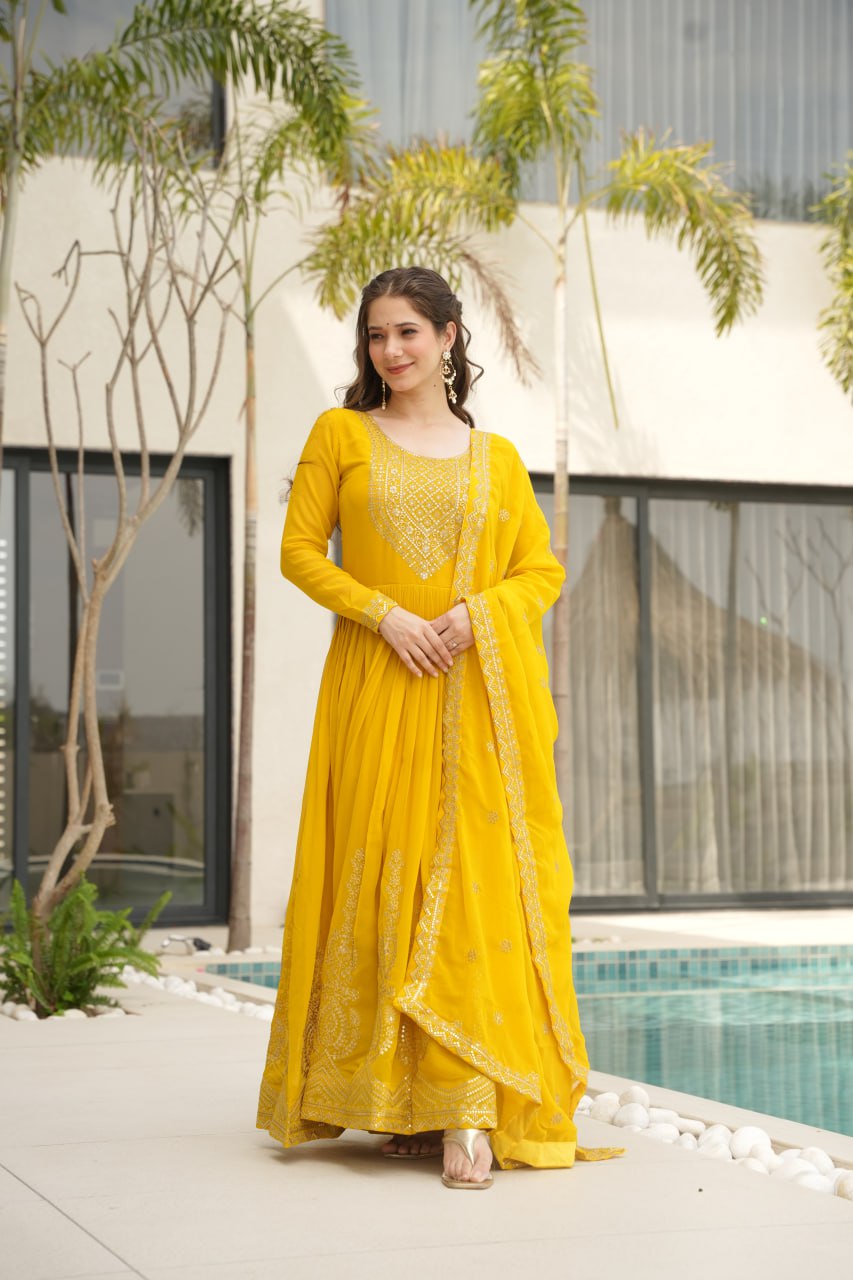 Yellow wedding gown for women with dupatta, embroidered gown design, full sleeve gown, Indian ethnic gown, stitched designer gown by Trinaari.