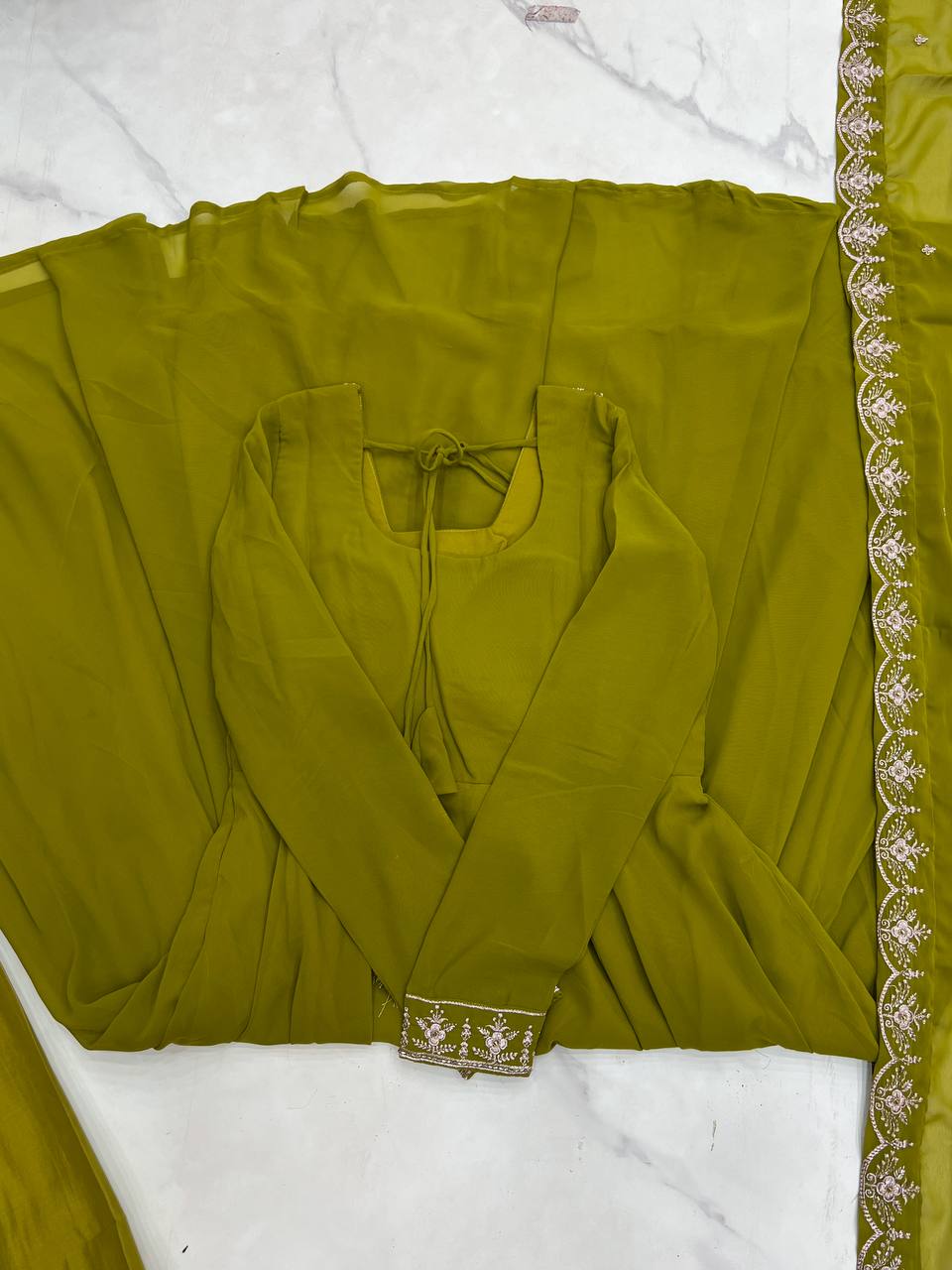 Green Anarkali suit in soft Fox Georgette with 6.5-meter flair, beads & zari embroidery, lace sleeves & dupatta – fully stitched & party-ready.