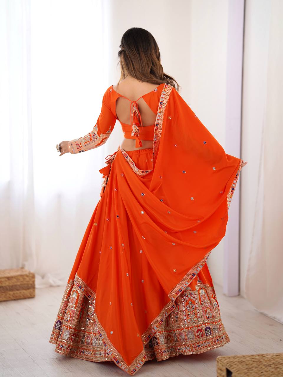 Kavyani Orange Crepe Silk Lehenga with dori-thread-sequin work, 3m flair & dupatta – semi-stitched festive wear for weddings.