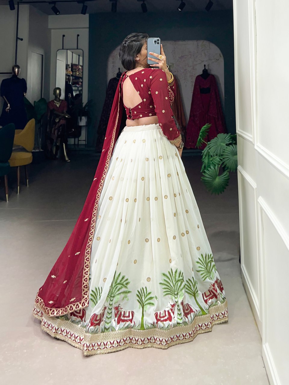 Bhavini Maroon Embroidered Georgette Lehenga Choli, featuring intricate sequins and thread embroidery with elegant lace detailing. The fully stitched lehenga has a 3.5-meter flair, can-can, and canvas stitching for a graceful silhouette. Paired with an unstitched embroidered georgette blouse and a matching dupatta with sequins work, this designer ensemble is perfect for weddings, festive occasions, and grand celebrations