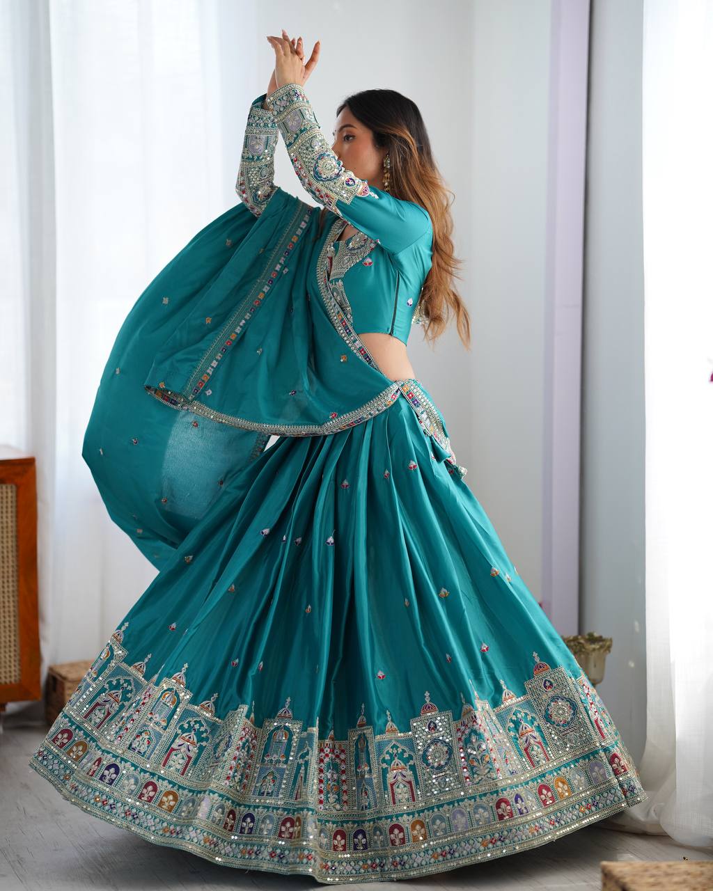 Kavyani Natural Crepe Silk Teal Color Lehenga Choli Set – semi-stitched lehenga with 3-meter flair, cancan and canvas patta, intricately embroidered with coding dori, thread, and sequins; paired with unstitched matching choli and embroidered dupatta with lace border, premium festive and wedding ethnic wear for women by Trinaari.