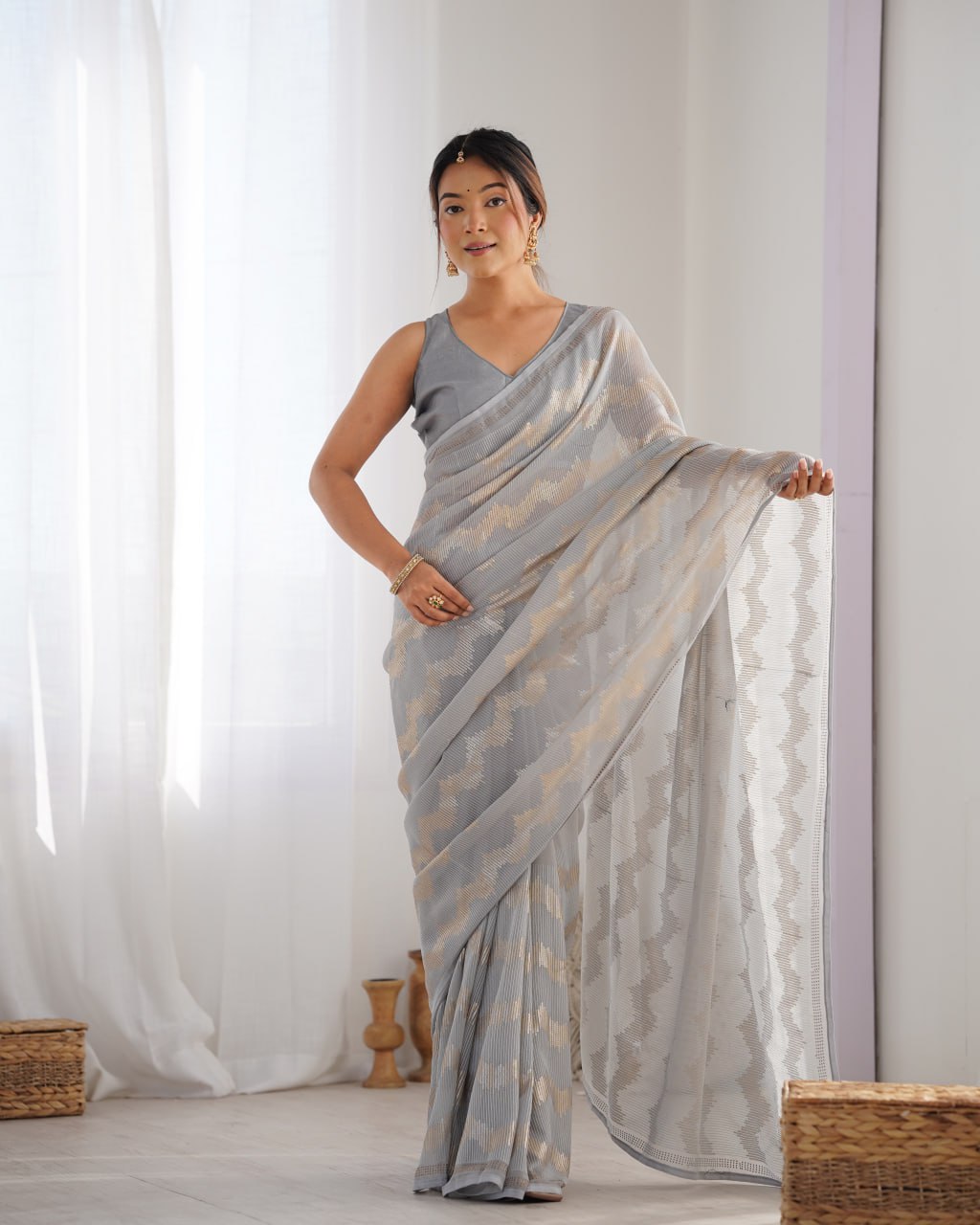 Graceful Aira Grey Georgette saree with heavy sequin embroidery and Seroski diamond embellishments, paired with an unstitched satin Banglori blouse – ideal bridal saree, festive saree, designer grey saree, elegant ethnic party wear, and luxury embroidered saree for women.