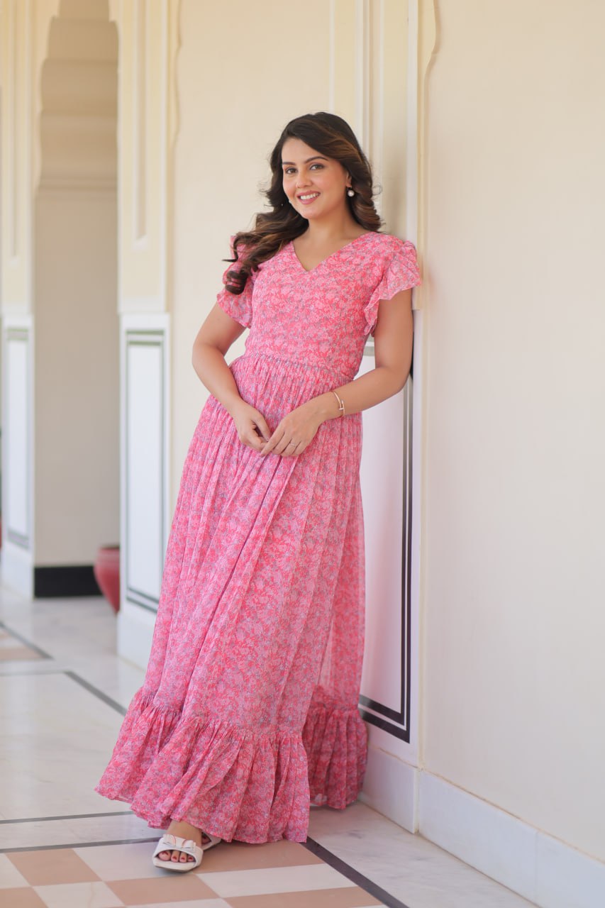 Printed pink georgette gown for women with 7-meter flair, bell sleeves & V-neck—lightweight ethnic dress for Haldi, Mehendi, Navratri & festive functions.