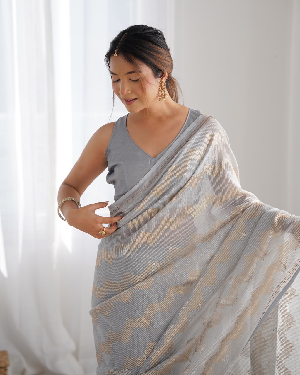Graceful Aira Grey Georgette saree with heavy sequin embroidery and Seroski diamond embellishments, paired with an unstitched satin Banglori blouse – ideal bridal saree, festive saree, designer grey saree, elegant ethnic party wear, and luxury embroidered saree for women.