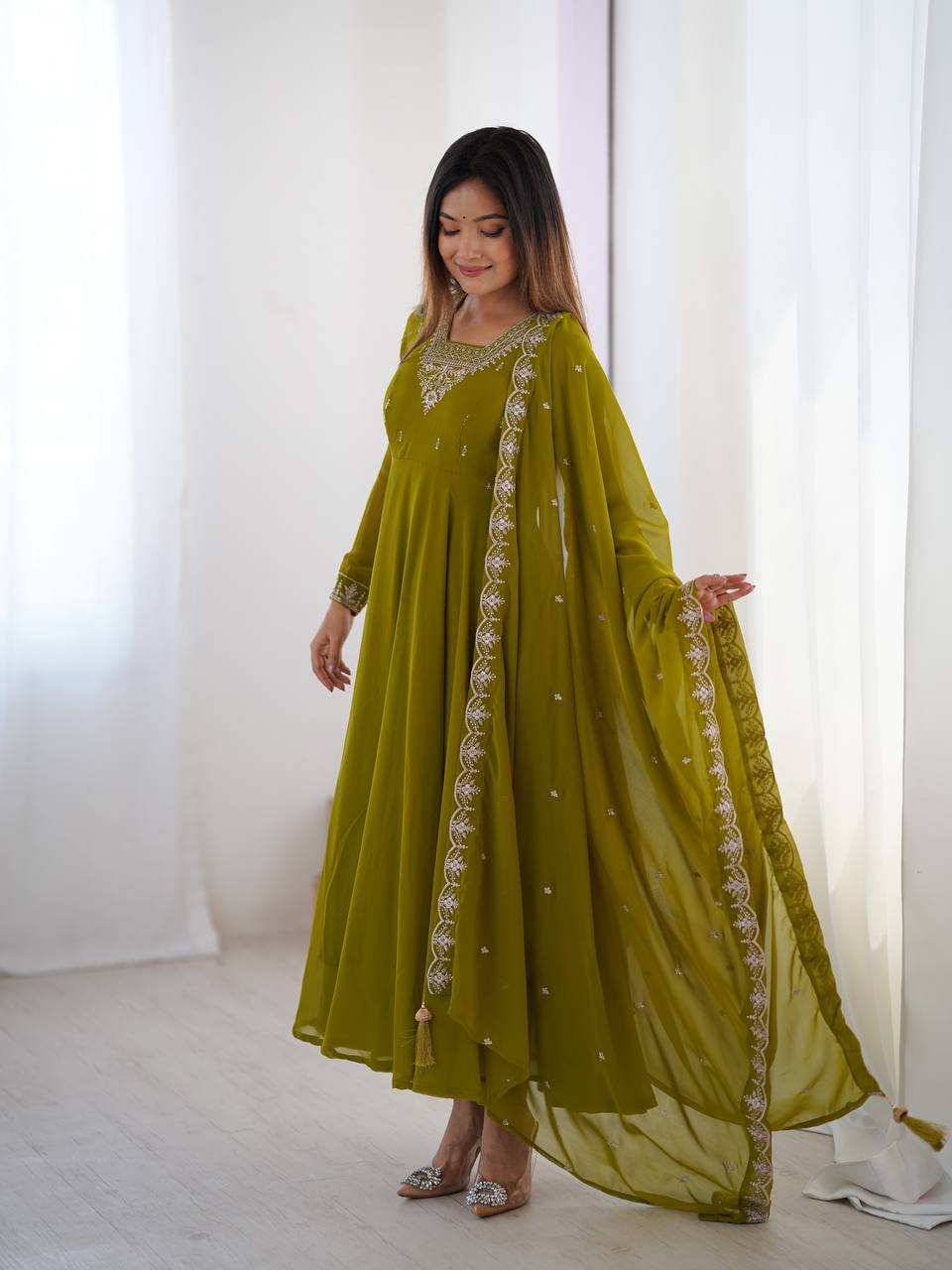Green Anarkali suit in soft Fox Georgette with 6.5-meter flair, beads & zari embroidery, lace sleeves & dupatta – fully stitched & party-ready.