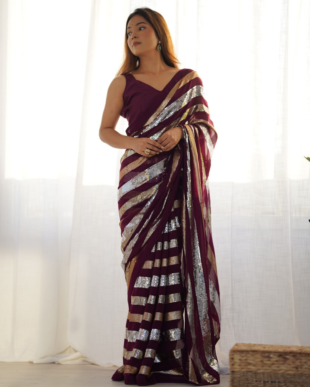 Kira Wine Georgette Saree with 3MM to 7MM sequin embroidery, elegant lining pattern and mono Banglory blouse – ideal sequin saree for wedding receptions, cocktail parties, festive wear, and premium Bollywood-style designer look.