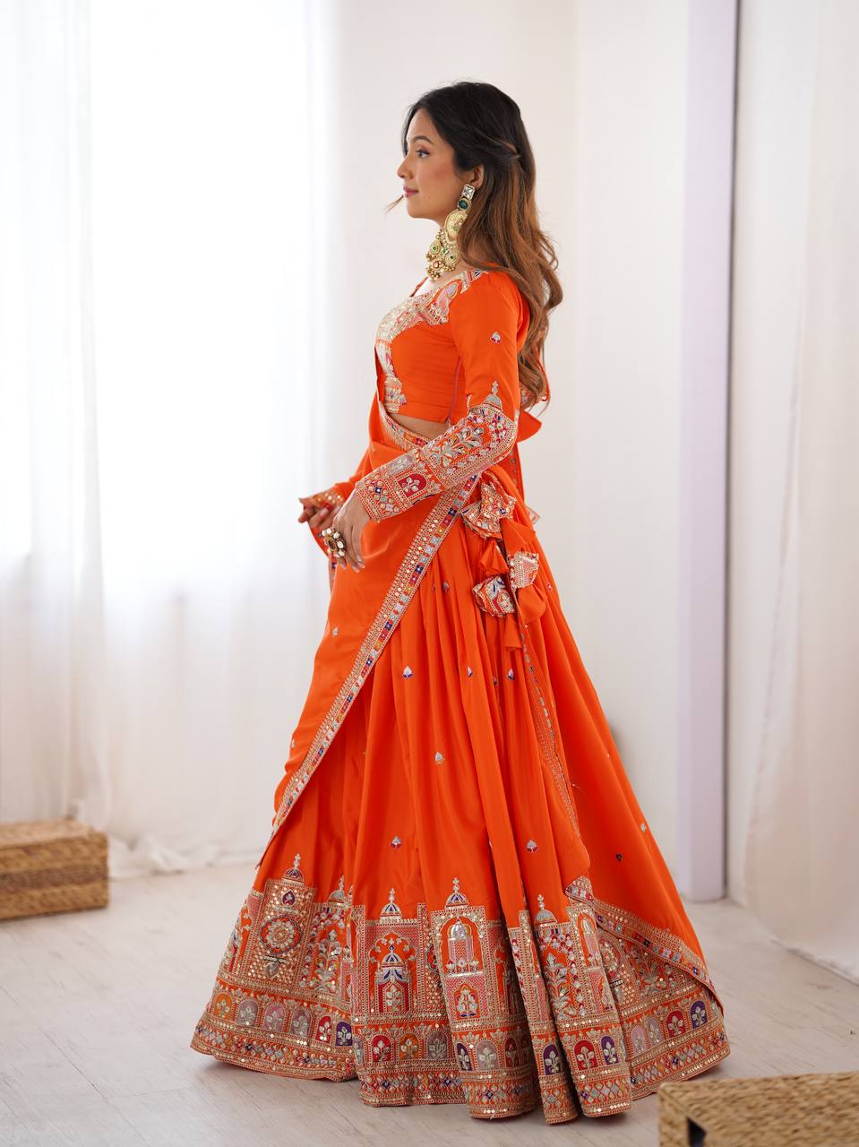 Kavyani Orange Crepe Silk Lehenga with dori-thread-sequin work, 3m flair & dupatta – semi-stitched festive wear for weddings.