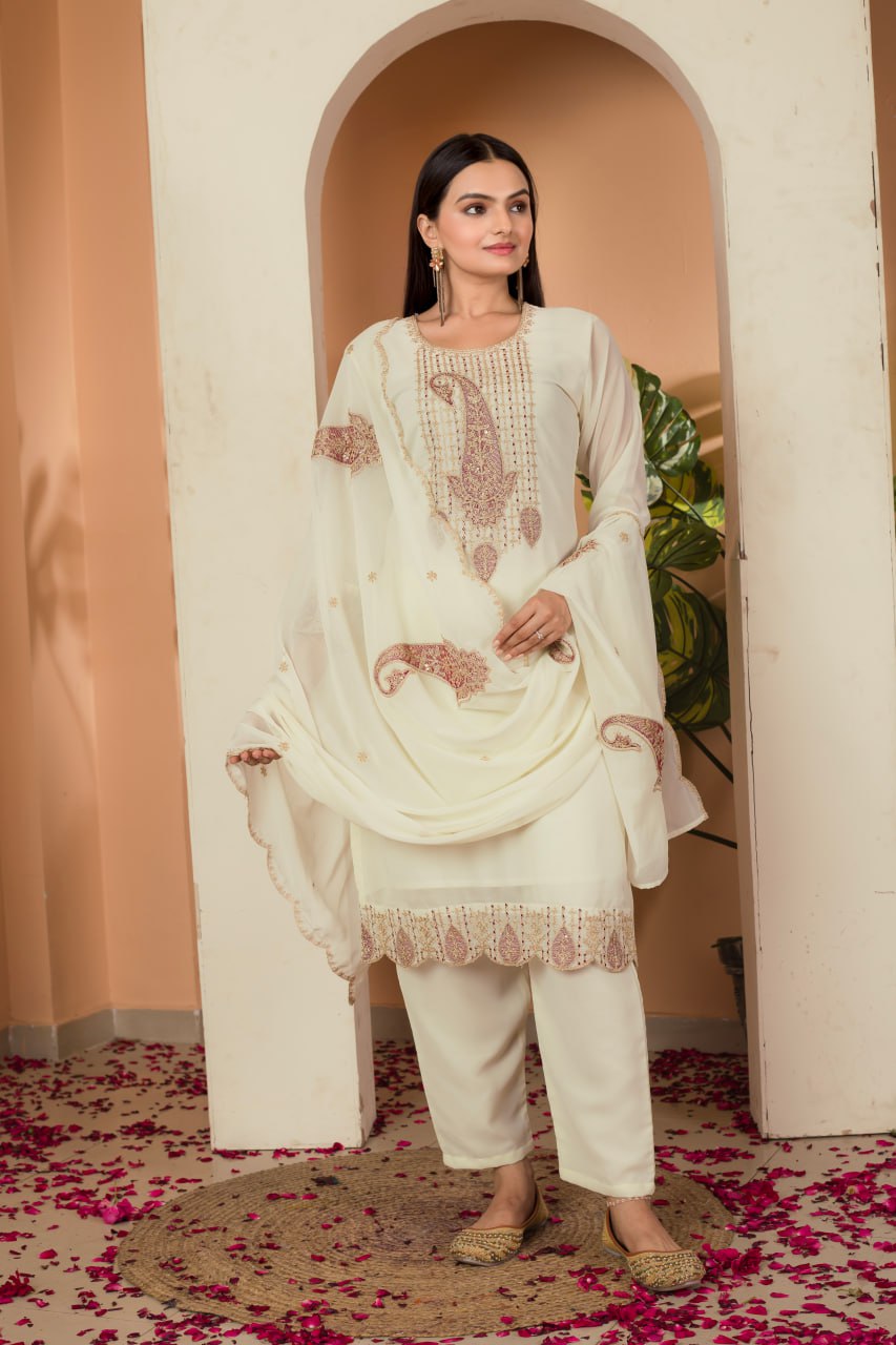 Khyati Off-White Embroidered Kurti Set crafted from premium Fox Georgette, featuring intricate heavy thread and sequins embroidery. This elegant ensemble includes a fully stitched kurti with a butter crepe lining, a matching stitched bottom, and an embroidered Fox Georgette dupatta. Designed for festive gatherings and special occasions, it beautifully blends tradition with modern sophistication