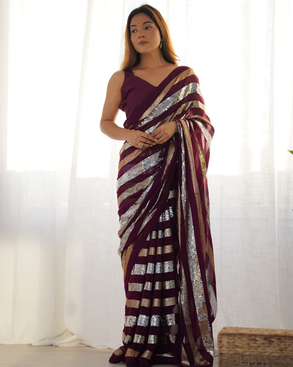 Kira Wine Georgette Saree with 3MM to 7MM sequin embroidery, elegant lining pattern and mono Banglory blouse – ideal sequin saree for wedding receptions, cocktail parties, festive wear, and premium Bollywood-style designer look.