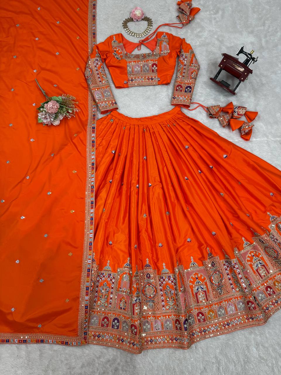 Kavyani Orange Crepe Silk Lehenga with dori-thread-sequin work, 3m flair & dupatta – semi-stitched festive wear for weddings.