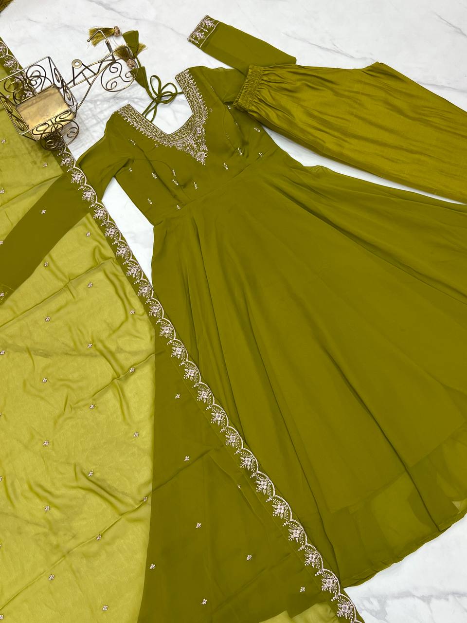 Green Anarkali suit in soft Fox Georgette with 6.5-meter flair, beads & zari embroidery, lace sleeves & dupatta – fully stitched & party-ready.