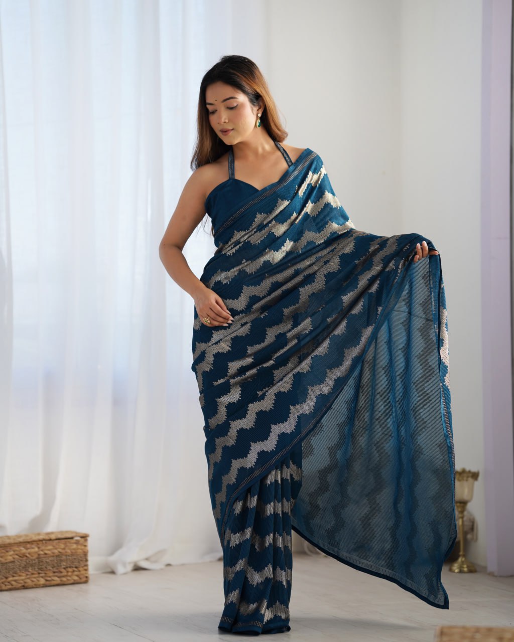 Elegant Aira Blue Georgette saree featuring heavy sequin embroidery and Seroski diamond work, paired with an unstitched satin Banglori blouse – perfect as a wedding saree, party wear saree, festive wear outfit, designer ethnic saree, and a must-have for lovers of premium georgette sarees.