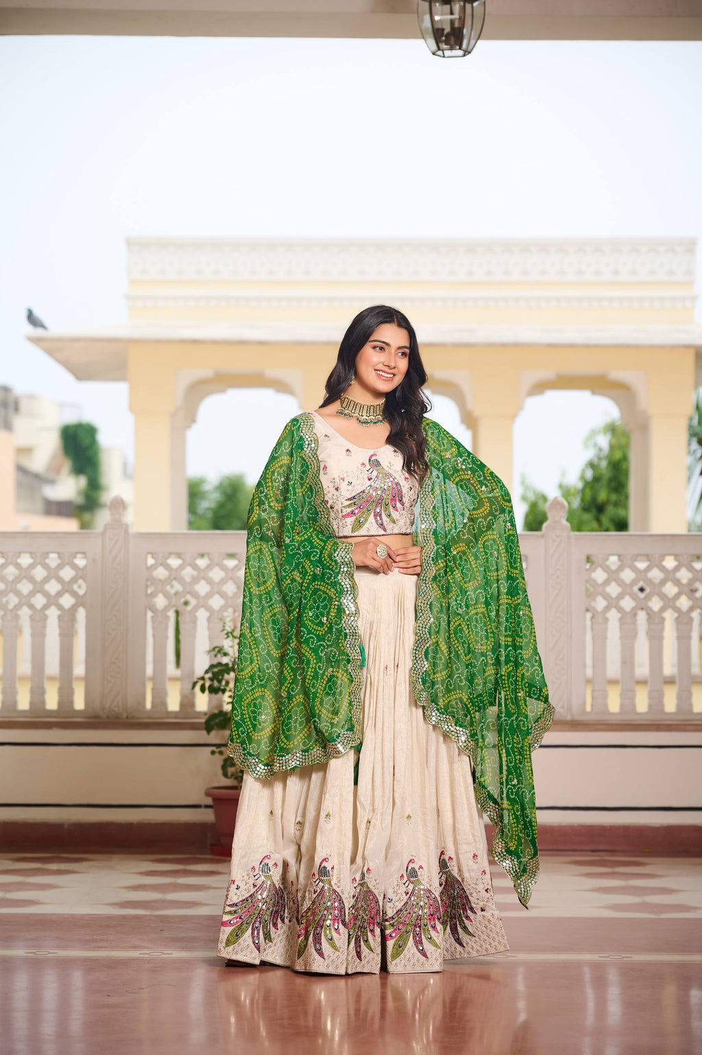 Amla off-white tissue silk lehenga choli with sequins thread work and green Bandhej dupatta