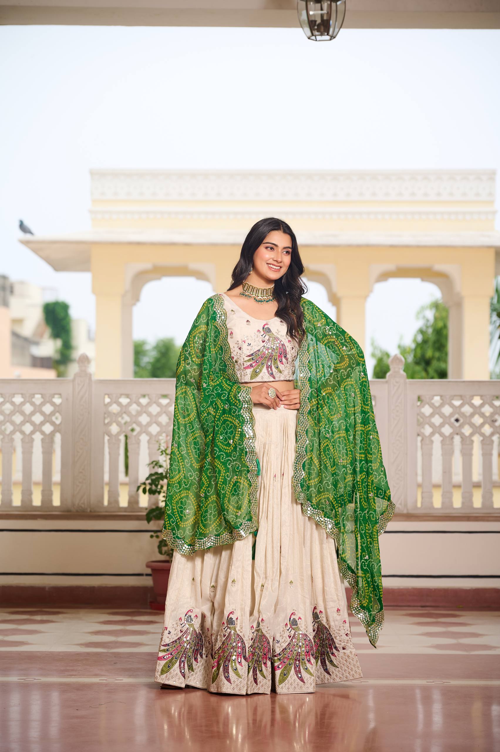 Amla Off-White Tissue Silk Sequins Thread Work Lehenga Choli with Green Bandhej Dupatta