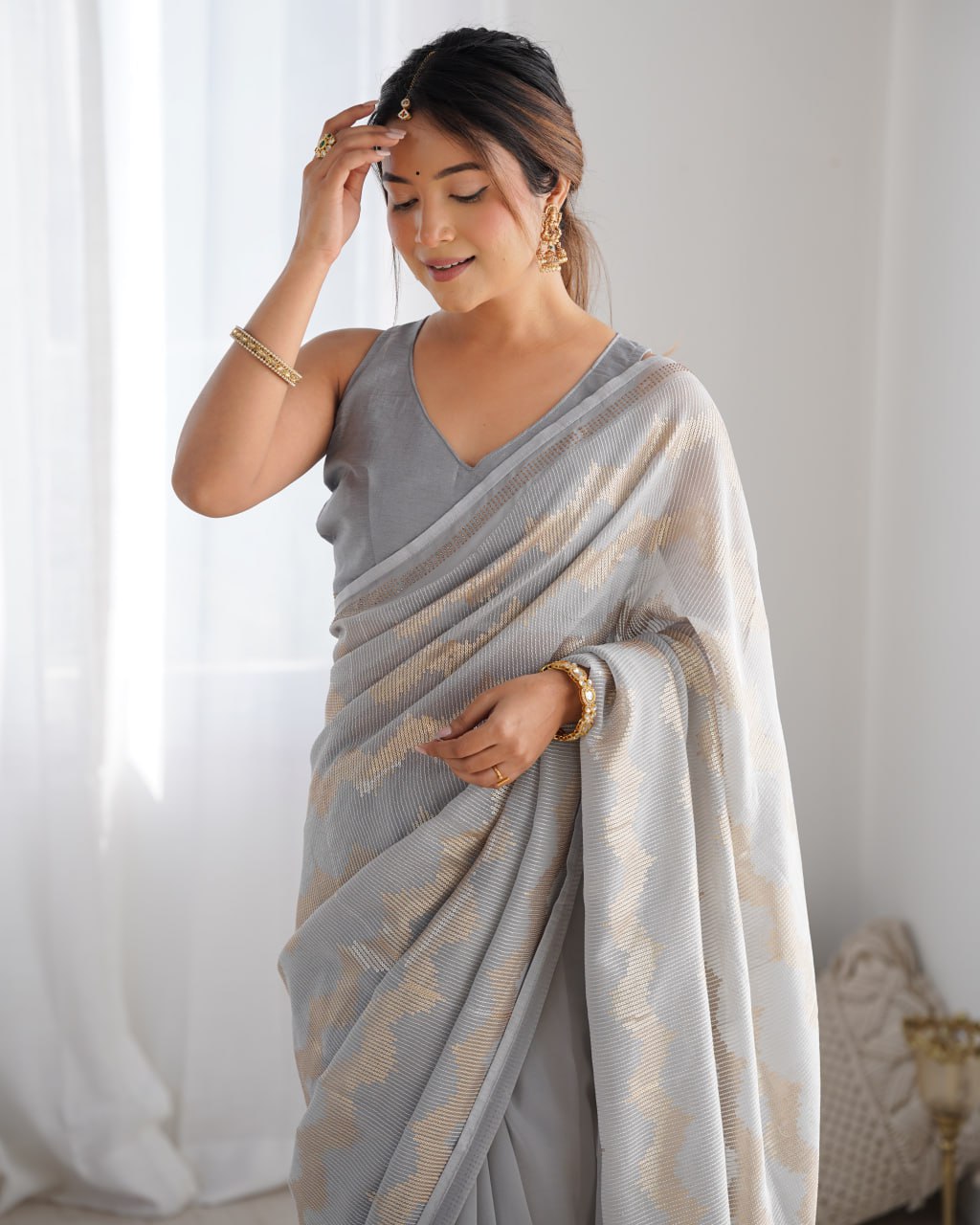 Graceful Aira Grey Georgette saree with heavy sequin embroidery and Seroski diamond embellishments, paired with an unstitched satin Banglori blouse – ideal bridal saree, festive saree, designer grey saree, elegant ethnic party wear, and luxury embroidered saree for women.