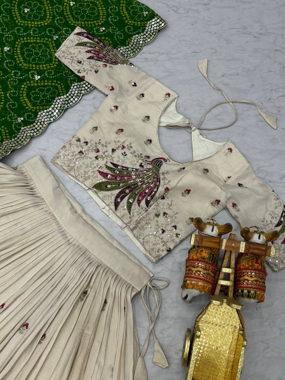 Amla off-white tissue silk lehenga choli with sequins thread work and green Bandhej dupatta