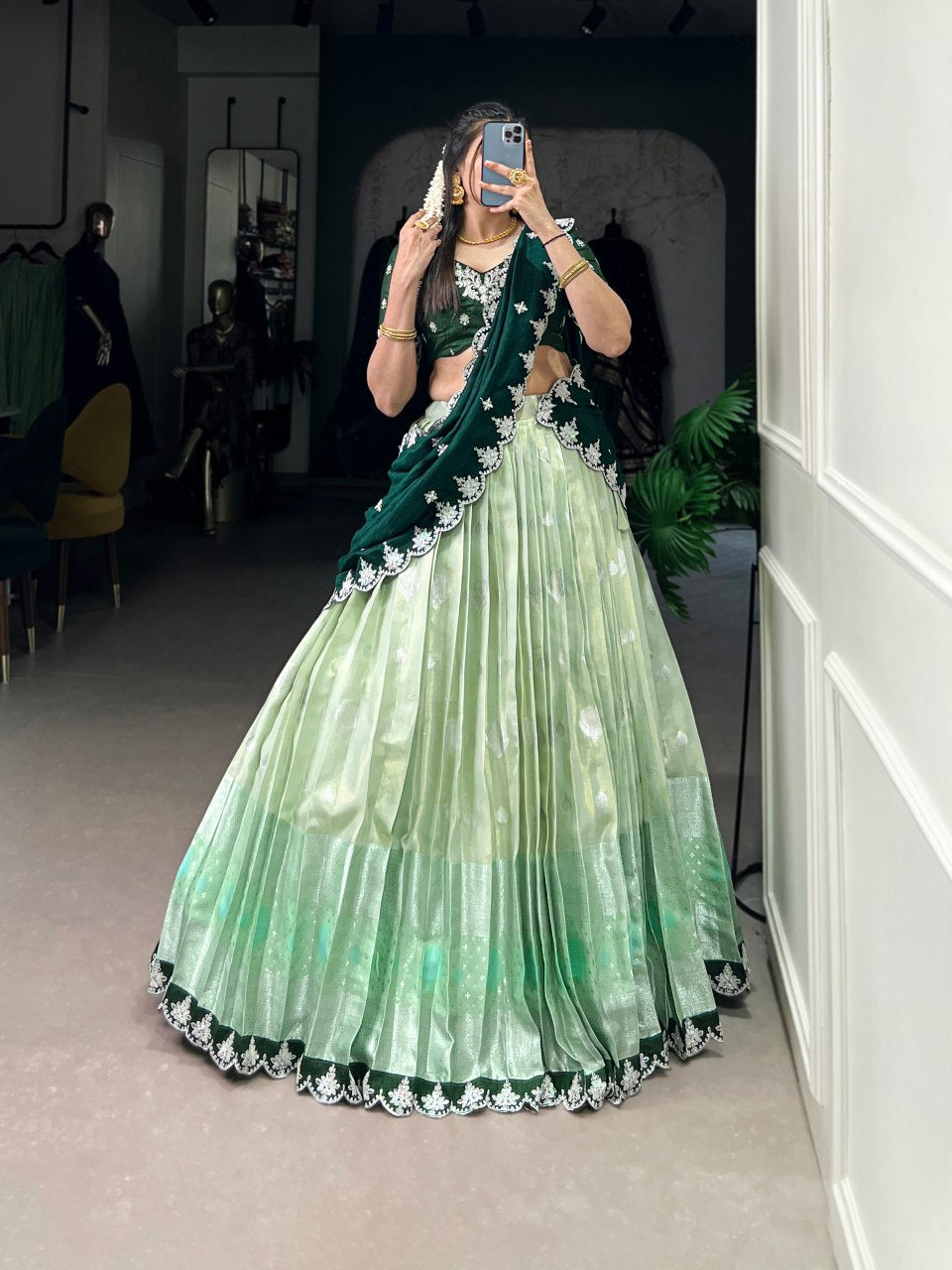 Pista green Zari Kota lehenga with intricate zari weaving work, paired with an embroidered Vichitra silk dupatta – a graceful outfit for festive and wedding occasions