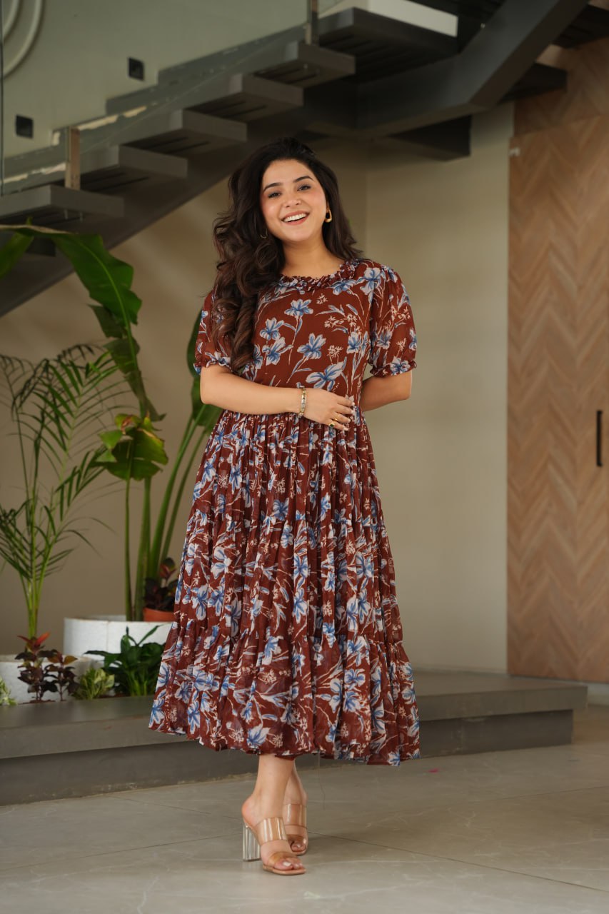 Vikarni Brown Printed Anarkali Gown in faux georgette with 12-meter flair & cotton lining – perfect for haldi, mehndi, festive & Indo-western occasions.