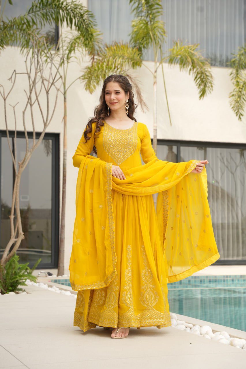 Yellow wedding gown for women with dupatta, embroidered gown design, full sleeve gown, Indian ethnic gown, stitched designer gown by Trinaari.