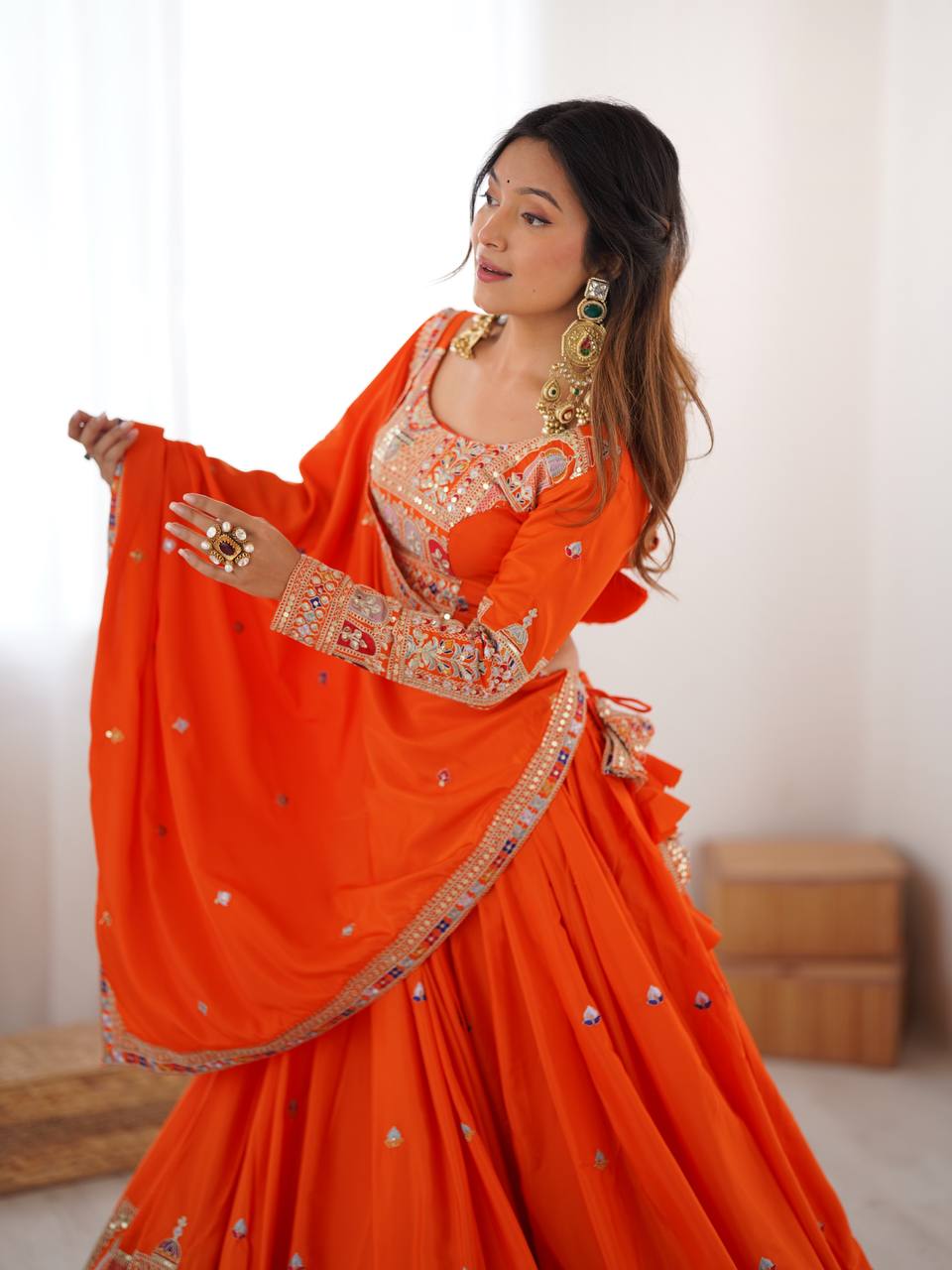 Kavyani Orange Crepe Silk Lehenga with dori-thread-sequin work, 3m flair & dupatta – semi-stitched festive wear for weddings.