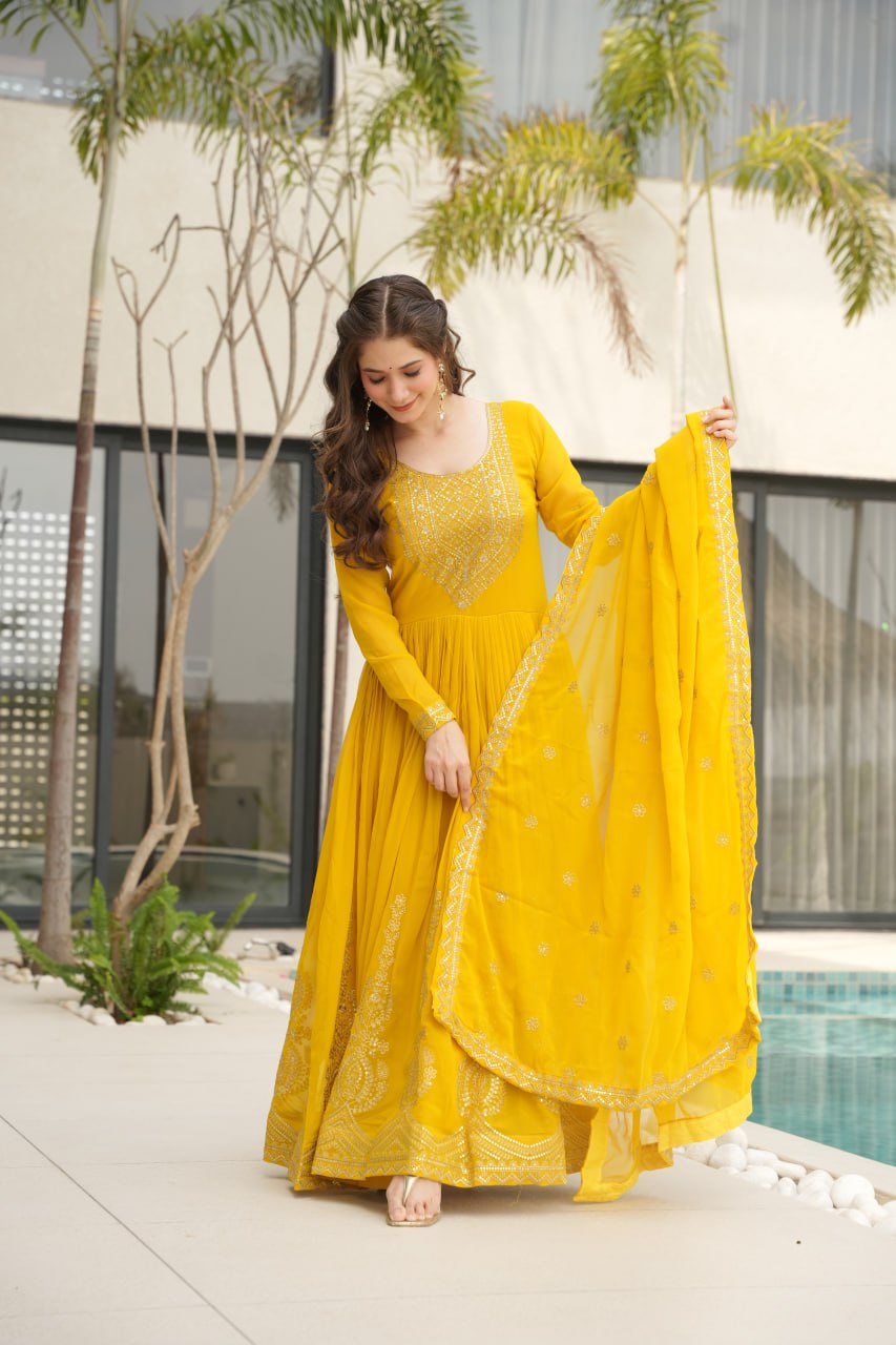 Yellow wedding gown for women with dupatta, embroidered gown design, full sleeve gown, Indian ethnic gown, stitched designer gown by Trinaari.