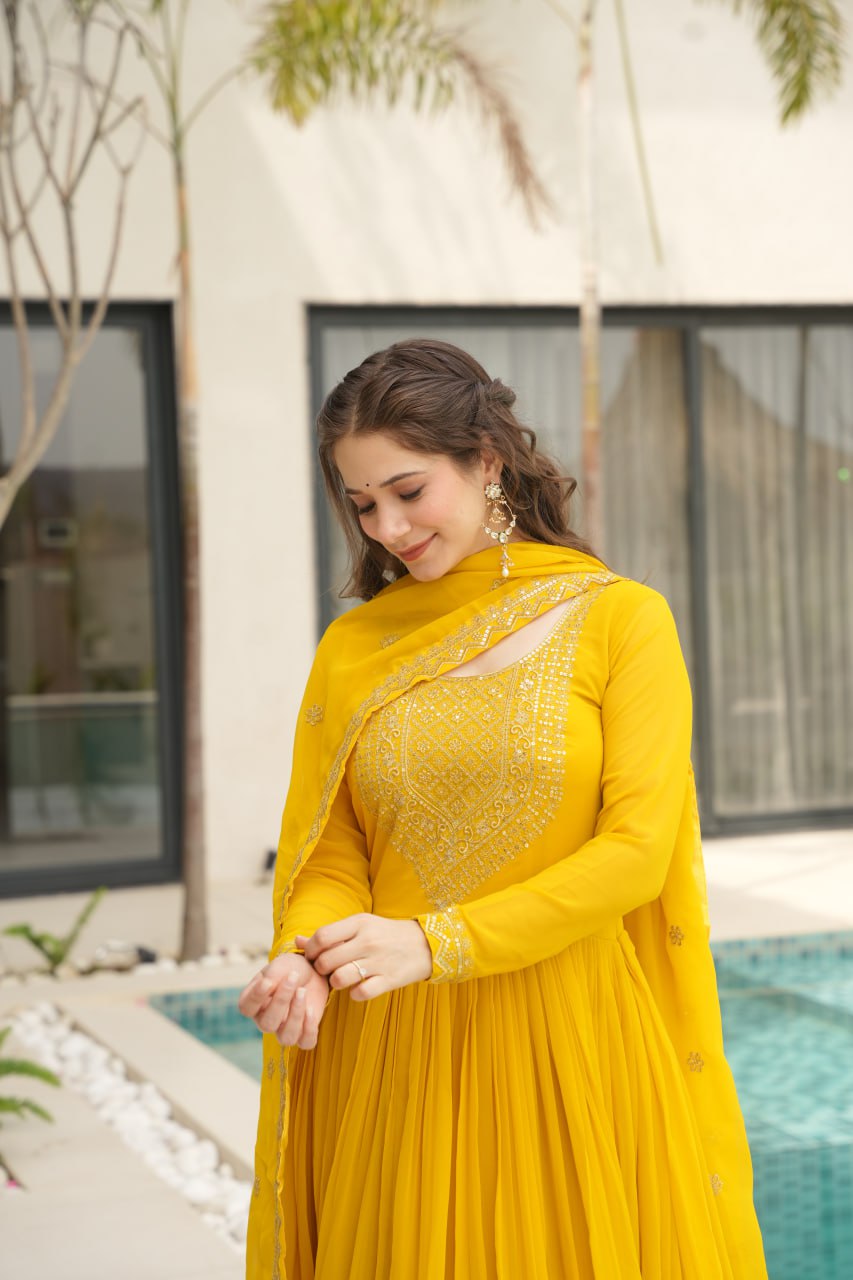 Yellow wedding gown for women with dupatta, embroidered gown design, full sleeve gown, Indian ethnic gown, stitched designer gown by Trinaari.