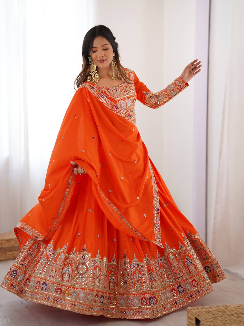 Kavyani Orange Crepe Silk Lehenga with dori-thread-sequin work, 3m flair & dupatta – semi-stitched festive wear for weddings.