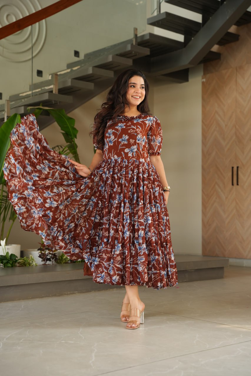Vikarni Brown Printed Anarkali Gown in faux georgette with 12-meter flair & cotton lining – perfect for haldi, mehndi, festive & Indo-western occasions.