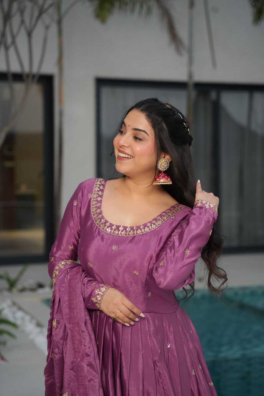 Harvisha mauve purple Chinon silk embroidered gown with full sleeves, floor-length 56-inch flair, rich sequin detailing, and matching embroidered dupatta – ideal Indian ethnic party gown for weddings, receptions, and festive occasions.