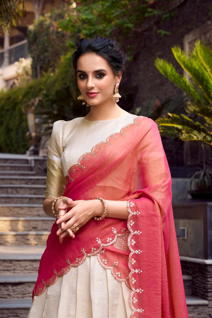 Off-white Jacquard Chex lehenga choli with intricate zari weaving, 4-meter flair, paired with shimmer dupatta featuring sequin and thread embroidery – perfect for weddings and festive celebrations.