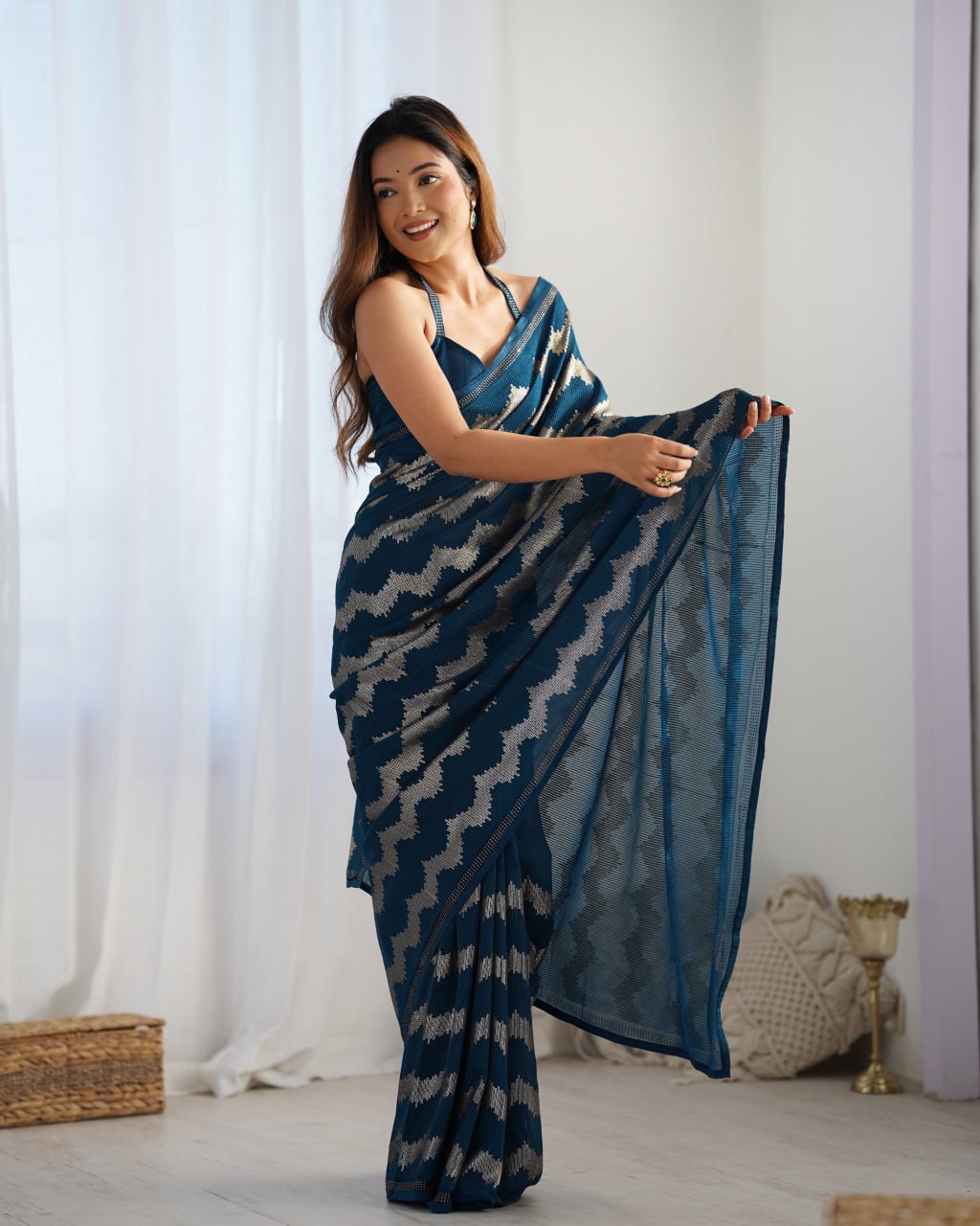 Elegant Aira Blue Georgette saree featuring heavy sequin embroidery and Seroski diamond work, paired with an unstitched satin Banglori blouse – perfect as a wedding saree, party wear saree, festive wear outfit, designer ethnic saree, and a must-have for lovers of premium georgette sarees.