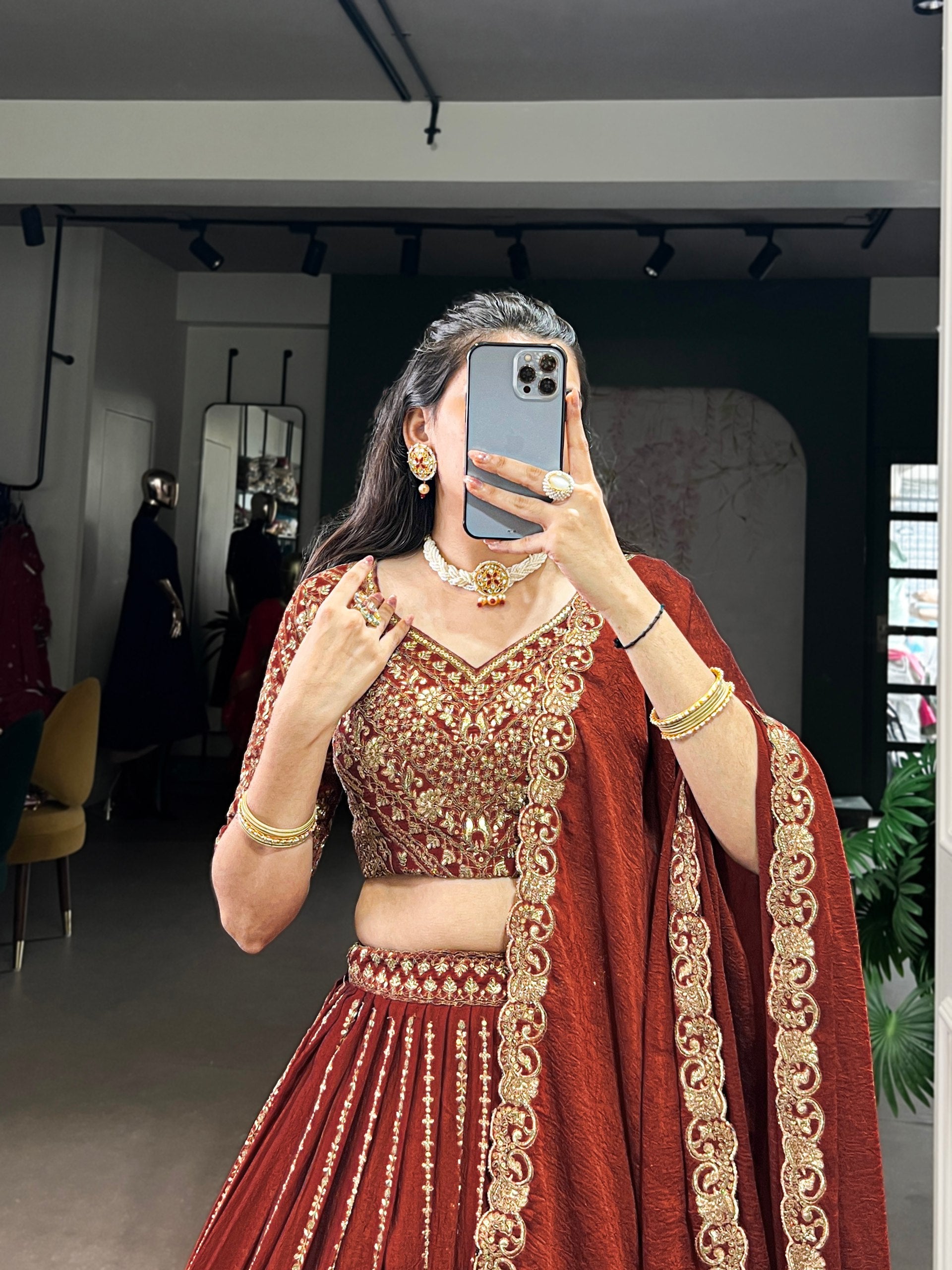Rust orange silk lehenga choli with sequins thread embroidery