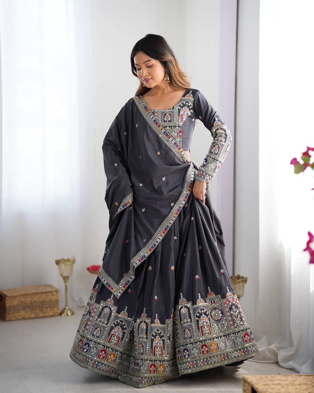 Kavyani Natural Crepe Silk Black Lehenga Choli Set – semi-stitched lehenga with 3-meter flair, cancan and canvas patta, intricately embroidered with coding dori, thread, and sequins; paired with unstitched matching choli and embroidered dupatta with lace border, premium festive and wedding ethnic wear for women by Trinaari.