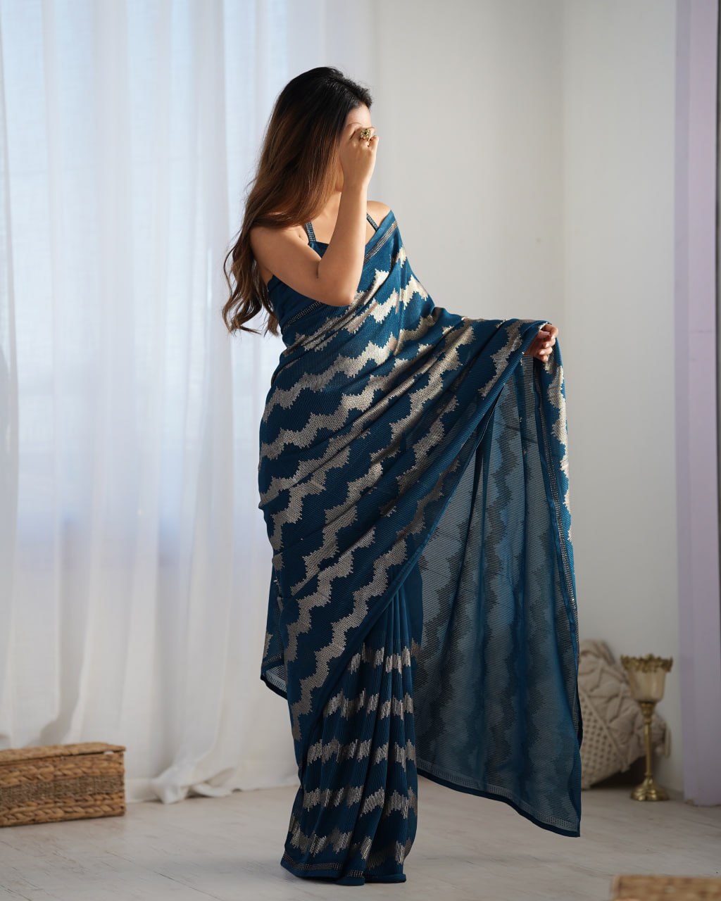 Elegant Aira Blue Georgette saree featuring heavy sequin embroidery and Seroski diamond work, paired with an unstitched satin Banglori blouse – perfect as a wedding saree, party wear saree, festive wear outfit, designer ethnic saree, and a must-have for lovers of premium georgette sarees.