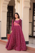Vani Choli Printed Wine Color Gown with staple jacquard fabric, full sleeves, cotton lining, and 3-meter flare – perfect ethnic party wear gown for wedding functions, festive nights, and modern Indian women.