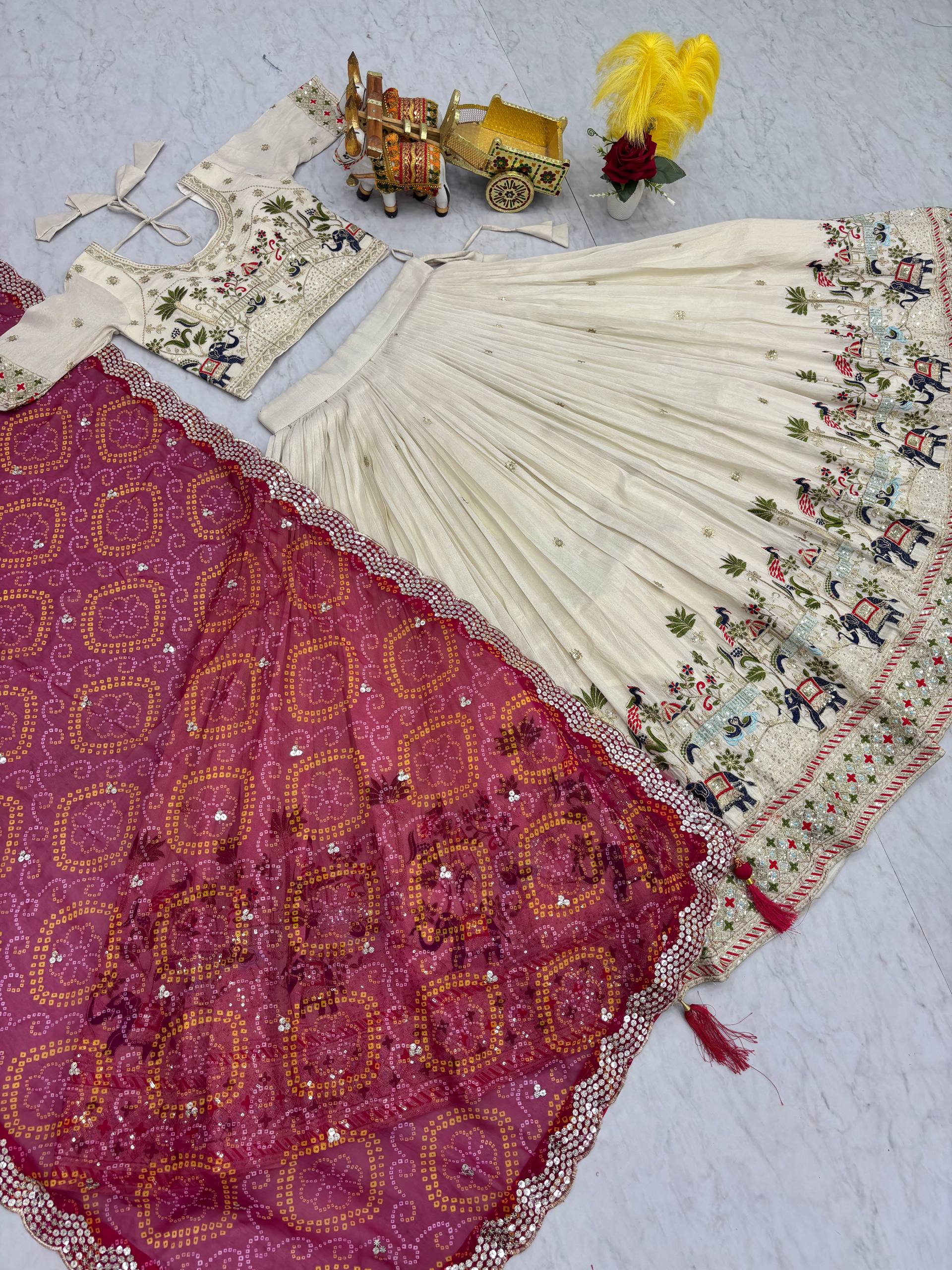 Off-white silk sequins thread embroidery lehenga choli with pink Bandhej dupatta