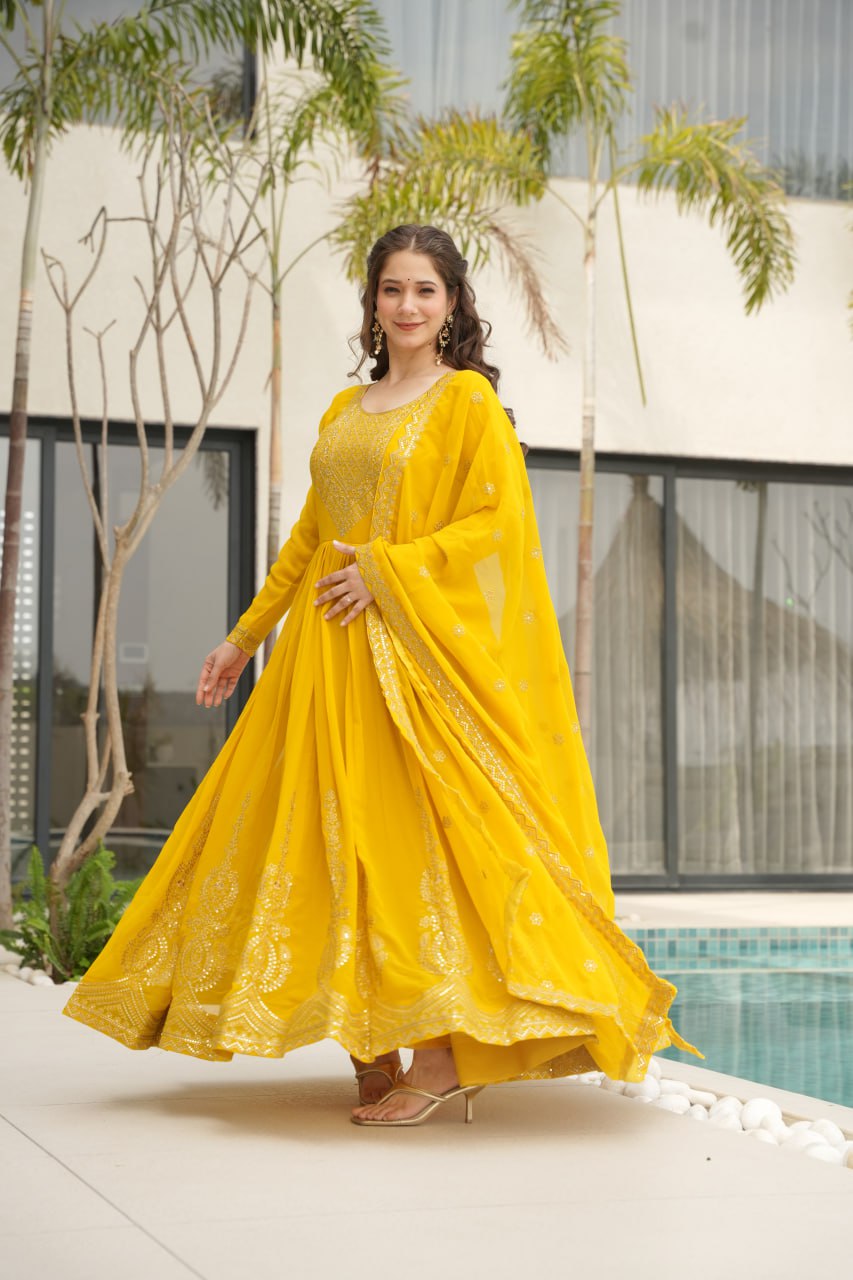 Yellow wedding gown for women with dupatta, embroidered gown design, full sleeve gown, Indian ethnic gown, stitched designer gown by Trinaari.
